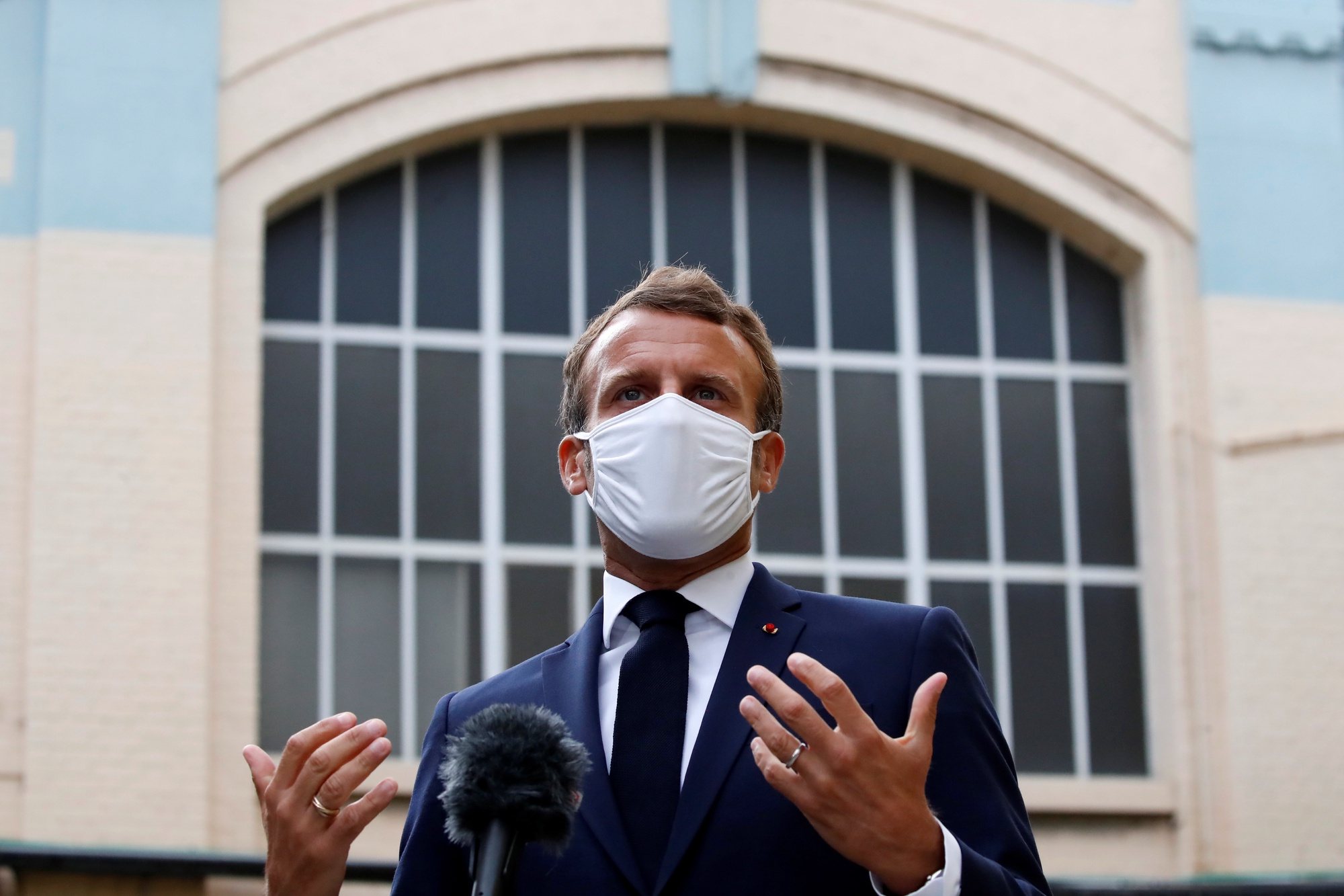 epa08630946 French President Emmanuel Macron, wearing a protective face mask, delivers a speech as he visits a site of pharmaceutical group Seqens, a global leader on the production of active pharmaceutical ingredients, to mobilize innovation and support the research on the coronavirus disease (COVID-19), in Villeneuve-la-Garenne, France, 28 August 2020.  EPA/CHRISTIAN HARTMANN / POOL  MAXPPP OUT