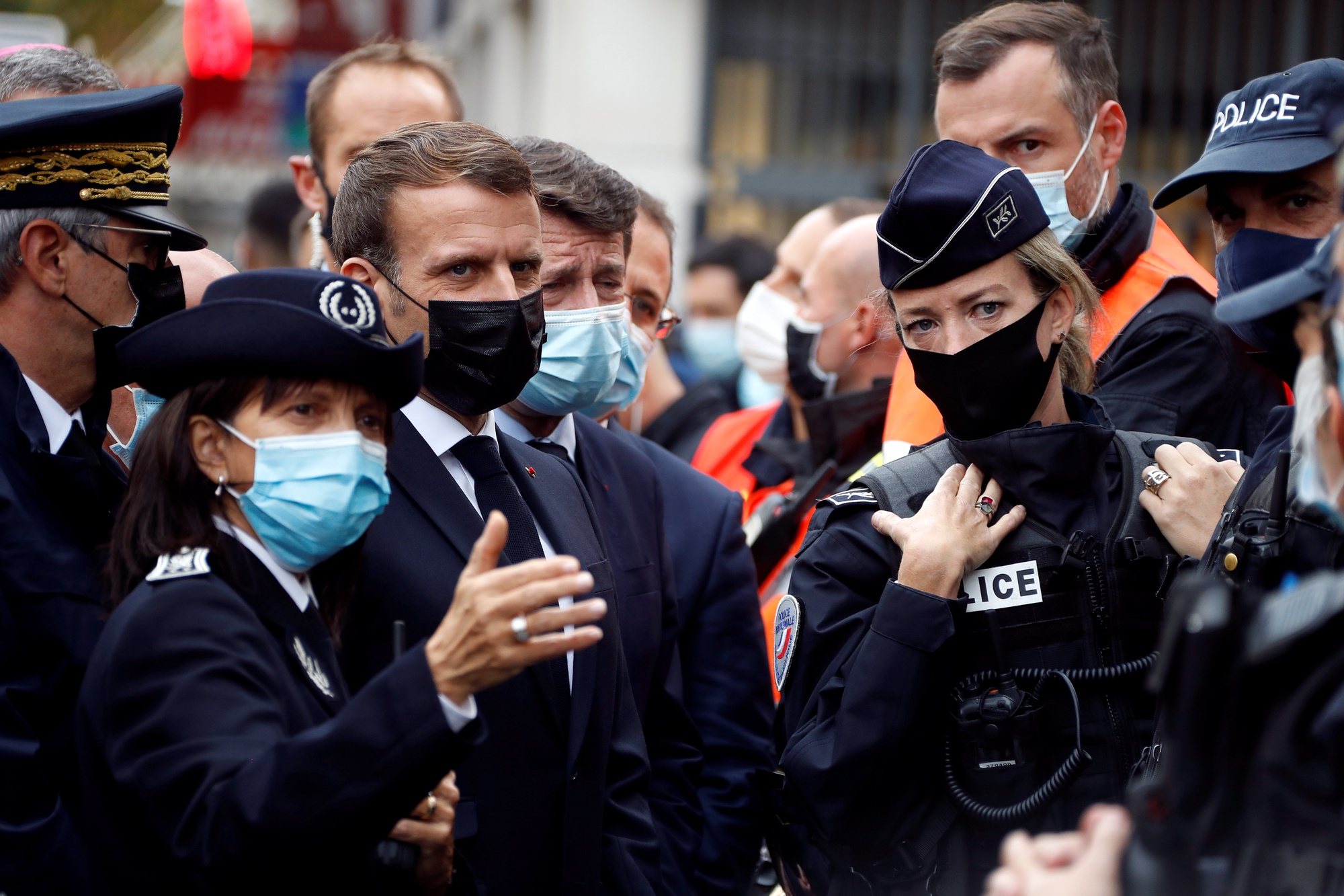 epa08783078 French President Emmanuel Macron (2-L) and Nice Mayor Christian Estrosi (3-L) visit the scene of a reported knife attack at Notre Dame church in Nice, France, 29 October 2020. According to recent reports, at least three people are reported to have died in what officials treat as a terror attack. The attack comes less than a month after the beheading of a French middle school teacher in Paris on 16 October.  EPA/ERIC GAILLARD / POOL  MAXPPP OUT