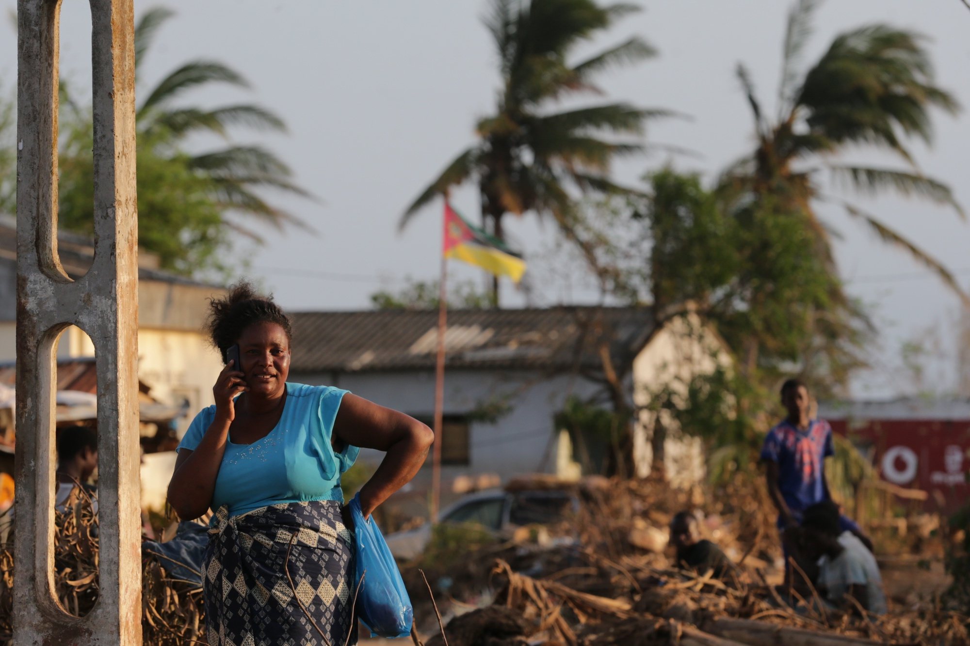 A woman talking on her cell phone to relatives in the village of Buzi, after the passage of cyclone Idai, in the province of Sofala, central Mozambique, 27 March 2019. Reports state that some 1.7 million people are said to be affected across southern Africa. TIAGO PETINGA/LUSA
