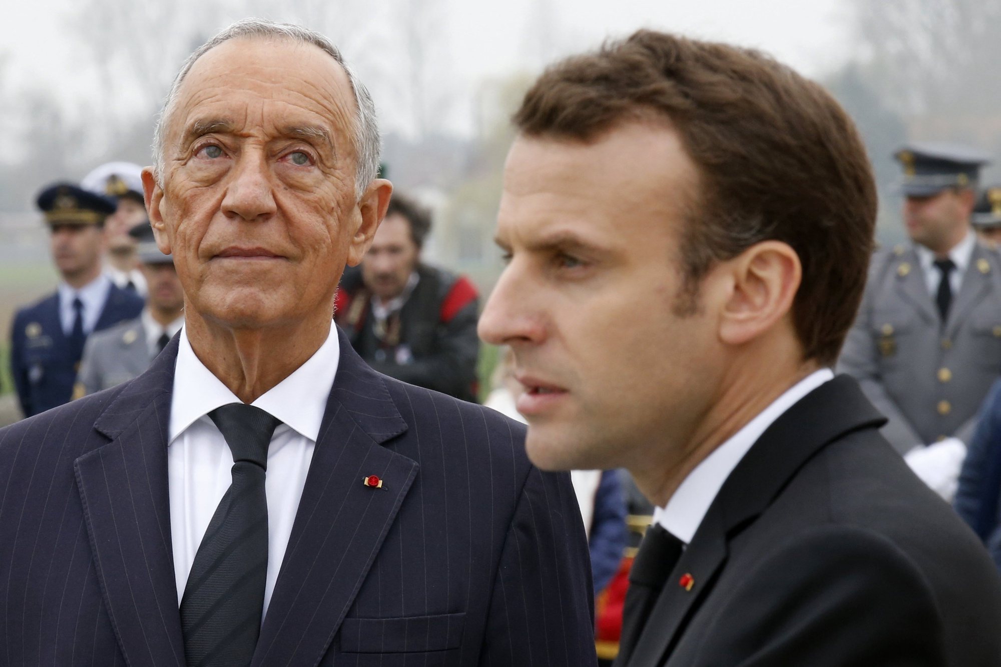 epa06657141 French President Emmanuel Macron (R) and Portuguese President Marcelo Rebelo de Sousa attend a World War One remembrance ceremony of the battle of la Lys at the WW1 Portuguese cemetery in Richebourg, France, 09 April 2018.  EPA/PASCAL ROSSIGNOL / POOL MAXPPP OUT