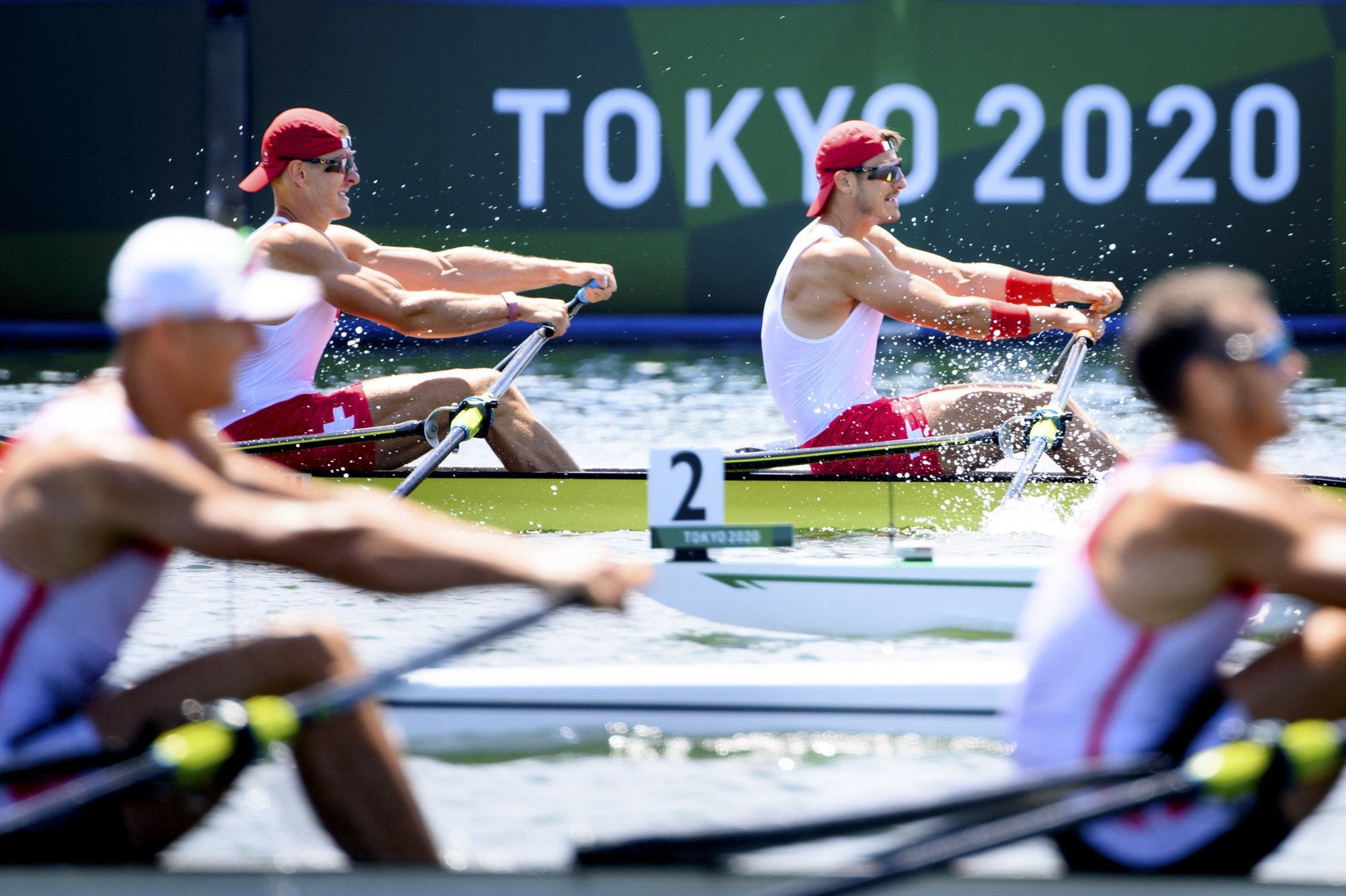 epaselect epa09359026 Swiss rowers Barnabe Delarze and Roman Roeoesli compete in the men&#039;s rowing double sculls heat at the 2020 Tokyo Summer Olympics in Tokyo, Japan, 23 July 2021.  EPA/LAURENT GILLIERON EDITORIAL USE ONLY