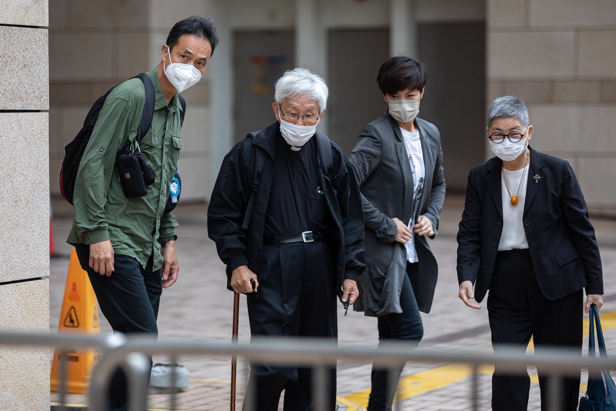 epa09970749 Scholar Hui Po-keung (L), Cardinal Joseph Zen (2-L), singer-activist Denise Ho (2-R), and prominent Hong Kong barrister Margaret Ng (R) arrive at the West Kowloon Magistrates&#039; Courts in Hong Kong, China, 24 May 2022. The four pro-democracy activists are on bail following their arrests by national security police after being accused of conspiring to collude with foreign powers in relation to a relief fund set up to providing legal assistance, medical treatment and emergency relief for protesters during the 2019 anti-extradition unrest.  EPA/JEROME FAVRE