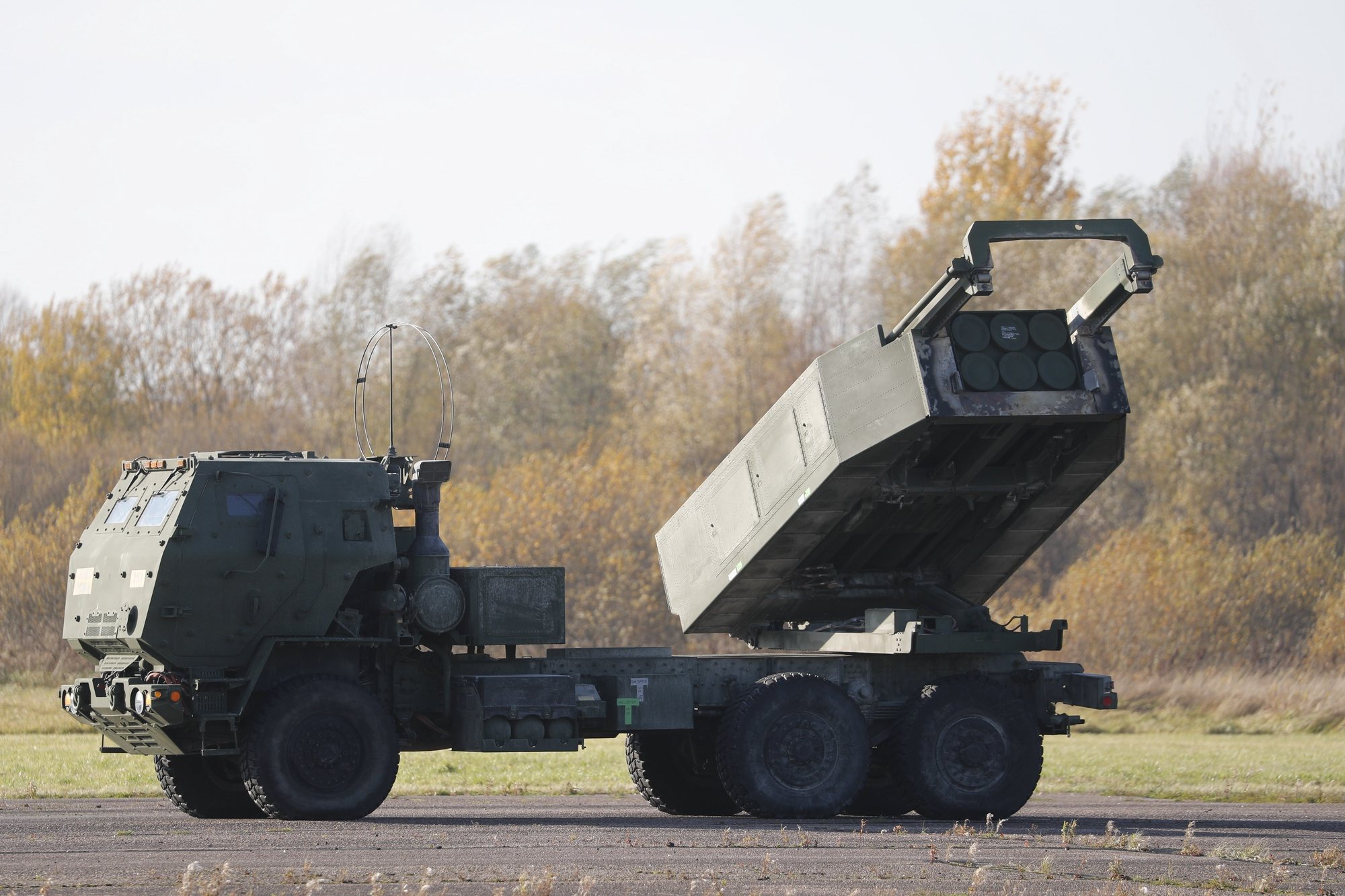epa09545432 A view of a US High Mobility Artillery Rocket System (HIMARS) during a landing exercise at Spilva airfield in Riga, Latvia, 25 October 2021. The US Air Force special operation aircraft MC-130J Commando II took part in a landing exercise demonstrating the rapid delivery and deployment of US Army High Mobility Artillery Rocket System (HIMARS). The aim of the exercise is to demonstrate the collective defense capabilities and the ability of the Allies to quickly deliver fire support capabilities to Latvia, providing support to the National Armed Forces in national defense.  EPA/TOMS KALNINS