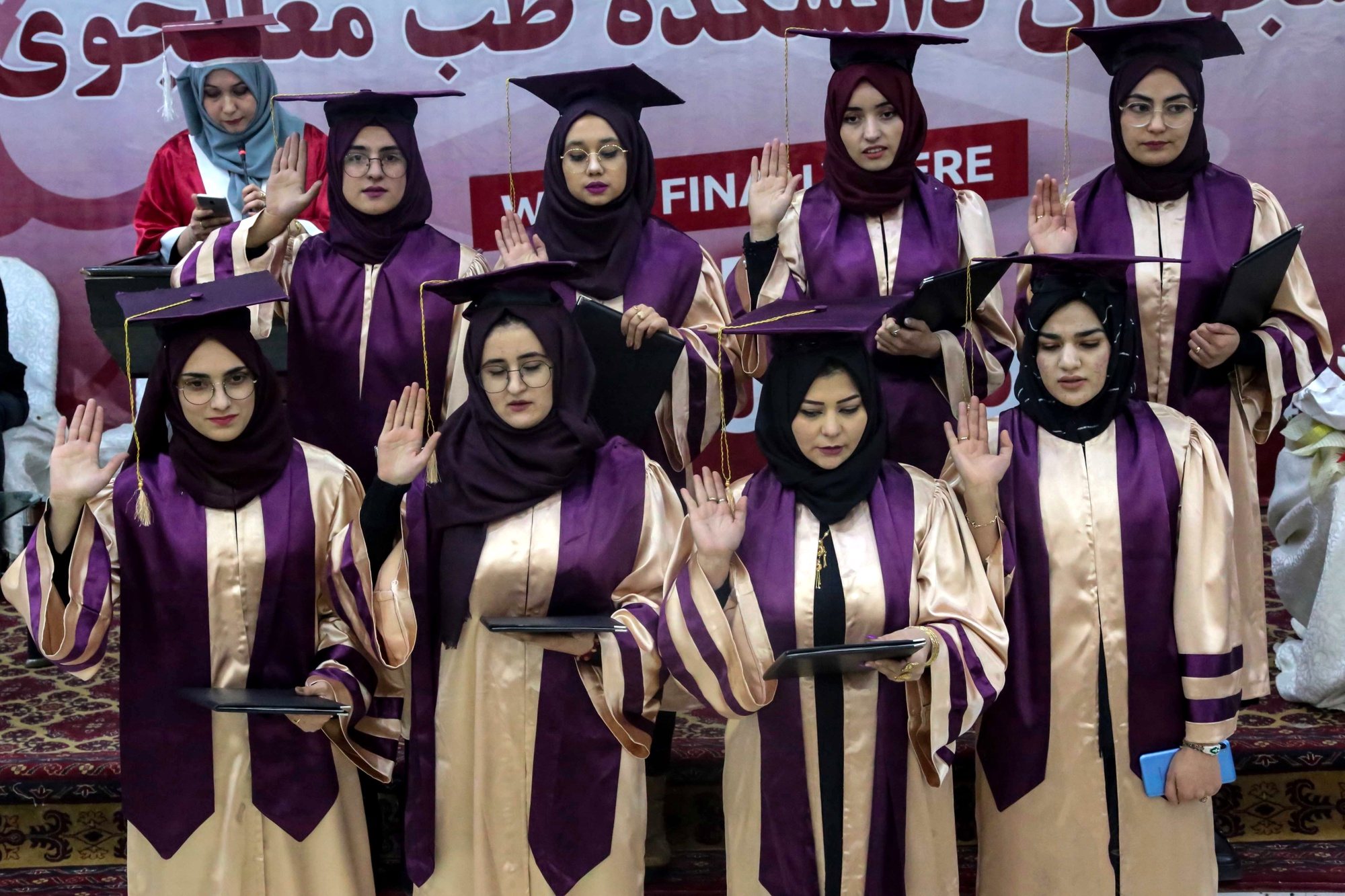 epa10388803 Afghan girls from a private university celebrate their graduation in Kabul, Afghanistan, 04 January 2023. A group of 24 male and nine female students at a private university were graduated from the Faculty of Medicine on 04 January. The ruling Taliban has banned women from attending university in Afghanistan, according to an order issued on 20 December 2022.  EPA/STRINGER