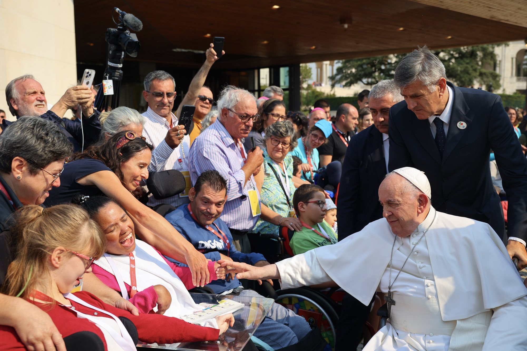 Pope Francis blesses sick pilgrims as he leaves the Chapel of the Apparitions at Shrine of Our Lady of Fatima, in Fatima, Ourem, Portugal, 05 August 2023. The Pontiff will be in Portugal on the occasion of World Youth Day (WYD), one of the main events of the Church that gathers the Pope with youngsters from around the world, that takes place until 06 August. ANTONIO COTRIM/LUSA/POOL