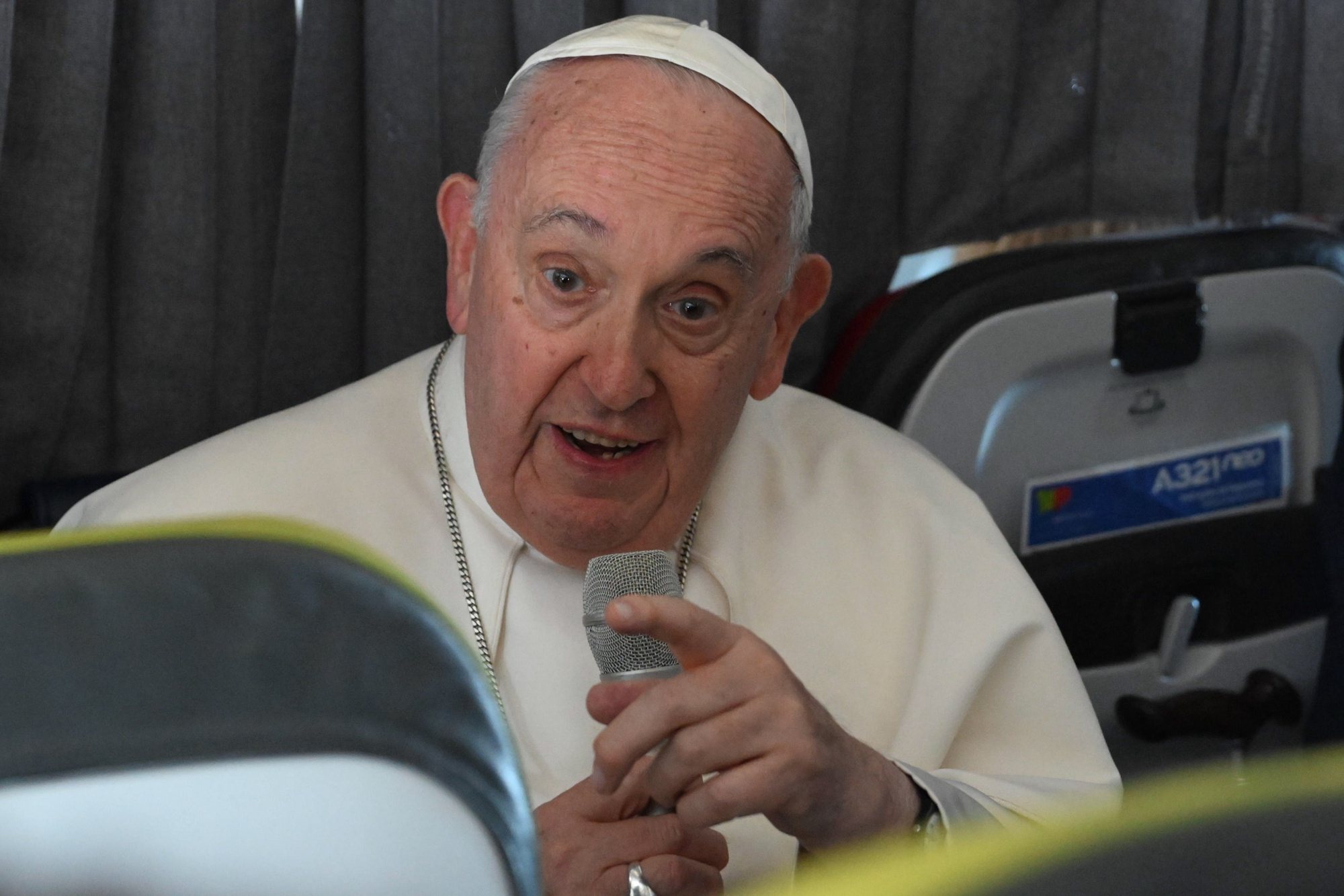 epa10788222 Pope Francis speaks with journalists during a press conference aboard the papal airplane heading to Rome, at the end of the 37th World Youth Day in Lisbon, Portugal, 06 August 2023. The Pontiff was in Portugal on the occasion of World Youth Day (WYD), one of the main events of the Church that gathers the Pope with youngsters from around the world.  EPA/MAURIZIO BRAMBATTI / POOL