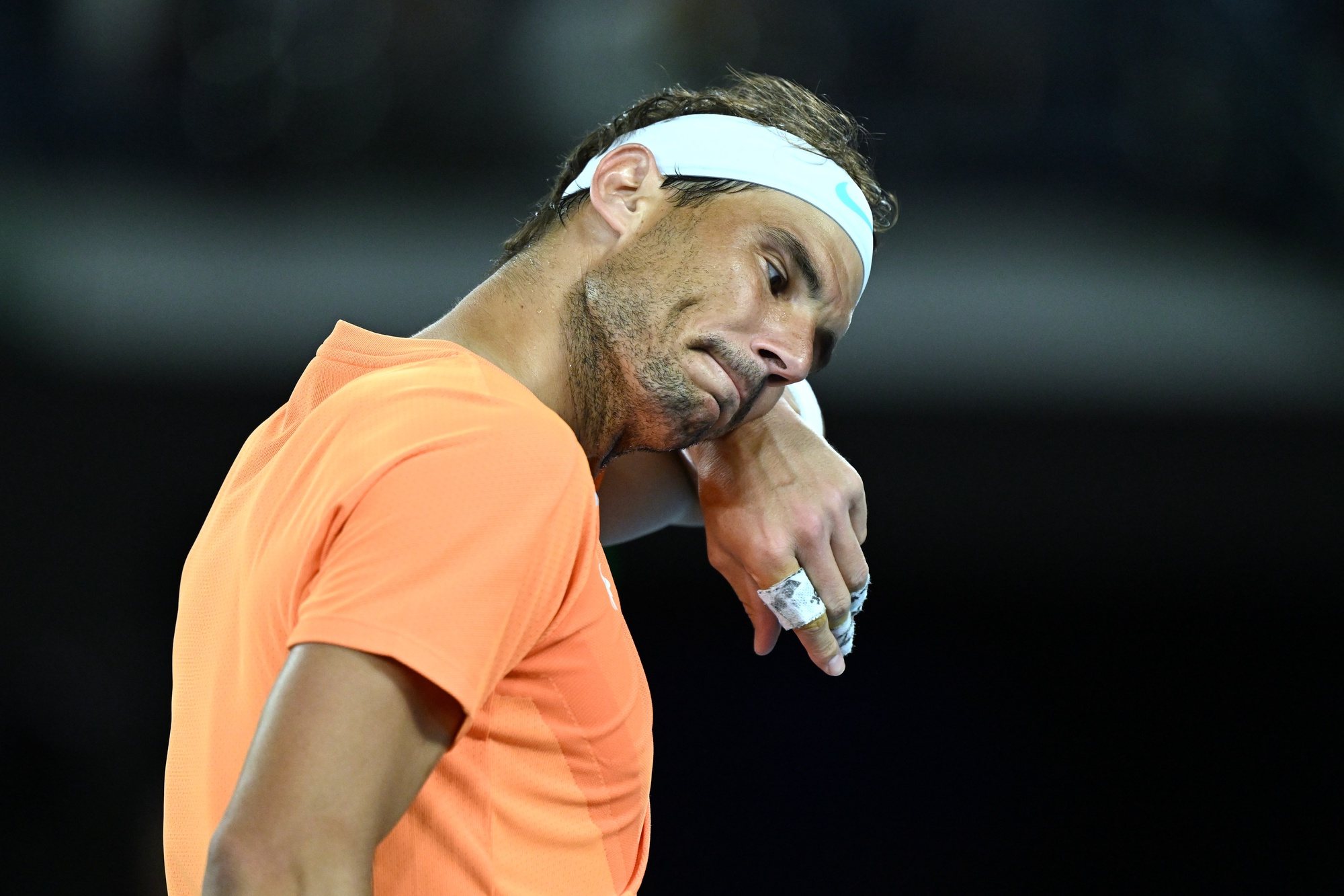 epa10412508 Rafael Nadal of Spain react during his match against Mackenzie McDonald of the USA  of the USA of the 2023 Australian Open tennis tournament at Melbourne Park in Melbourne, Australia, 18 January 2023.  EPA/LUKAS COCH AUSTRALIA AND NEW ZEALAND OUT