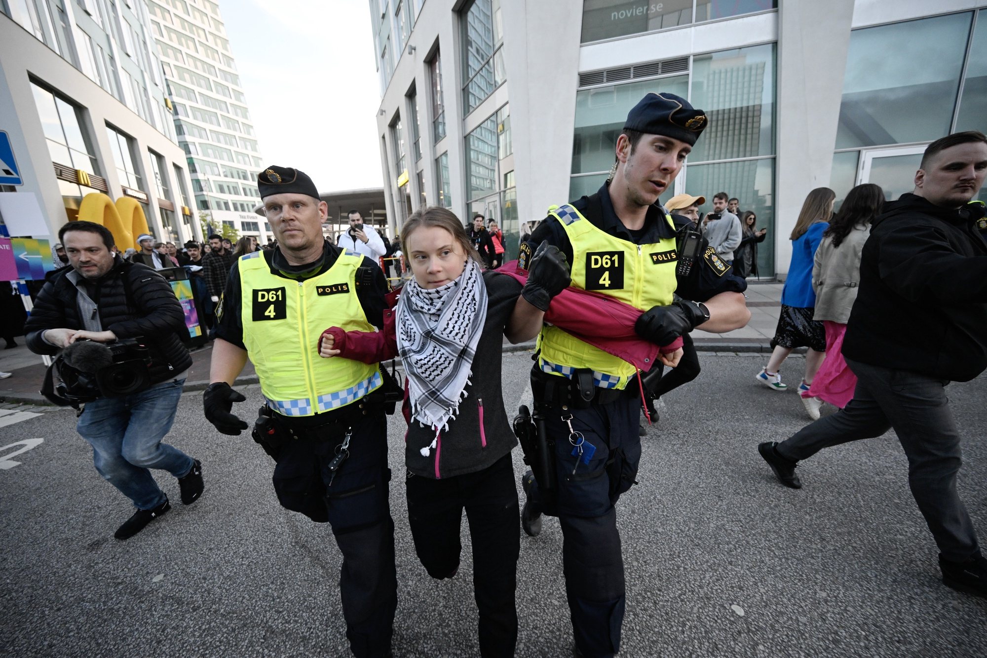 epaselect epa11333733 Swedish climate activist Greta Thunberg (C) is removed by police outside Malmo Arena during a pro-Palestinian rally against the participation of Israel in the 68th Eurovision Song Contest (ESC) in Malmo, Sweden, 11 May 2024. Protesters call for Israel&#039;s expulsion from the singing contest over the ongoing situation in the Gaza Strip. In 2022 Russia was prevented from participating in Eurovision over its invasion of Ukraine.  EPA/Johan Nilsson/TT SWEDEN OUT