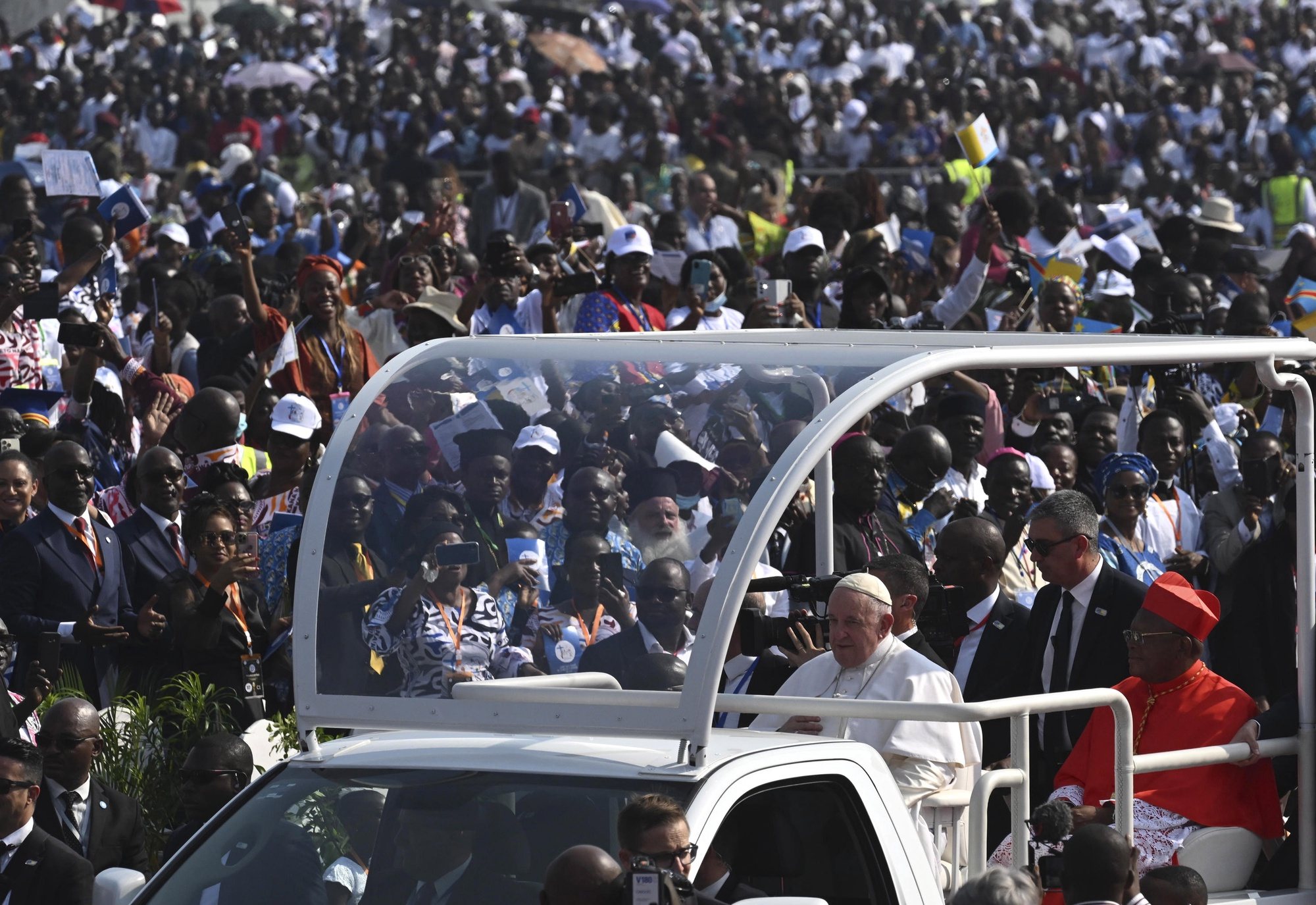 epa10442299 Pope Francis greeted by huge crowds upon his arrival, to celebrate Holy Mass, in the area of the Ndolo Airport  in the Kinshasa city during the Apostolic Journey of His Holinass  to the Democratic Republic of Congo, 01 February 2023.  EPA/CIRO FUSCO