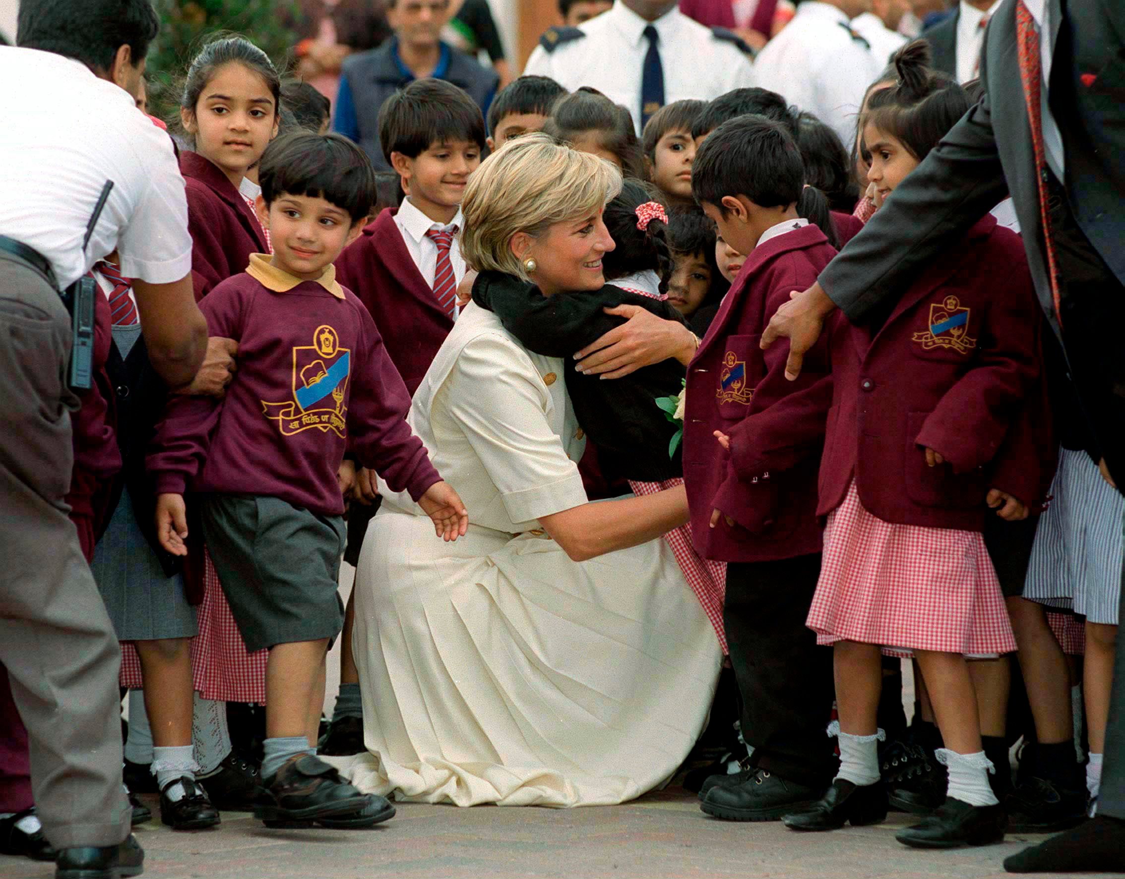 Child Hugs Princess Diana