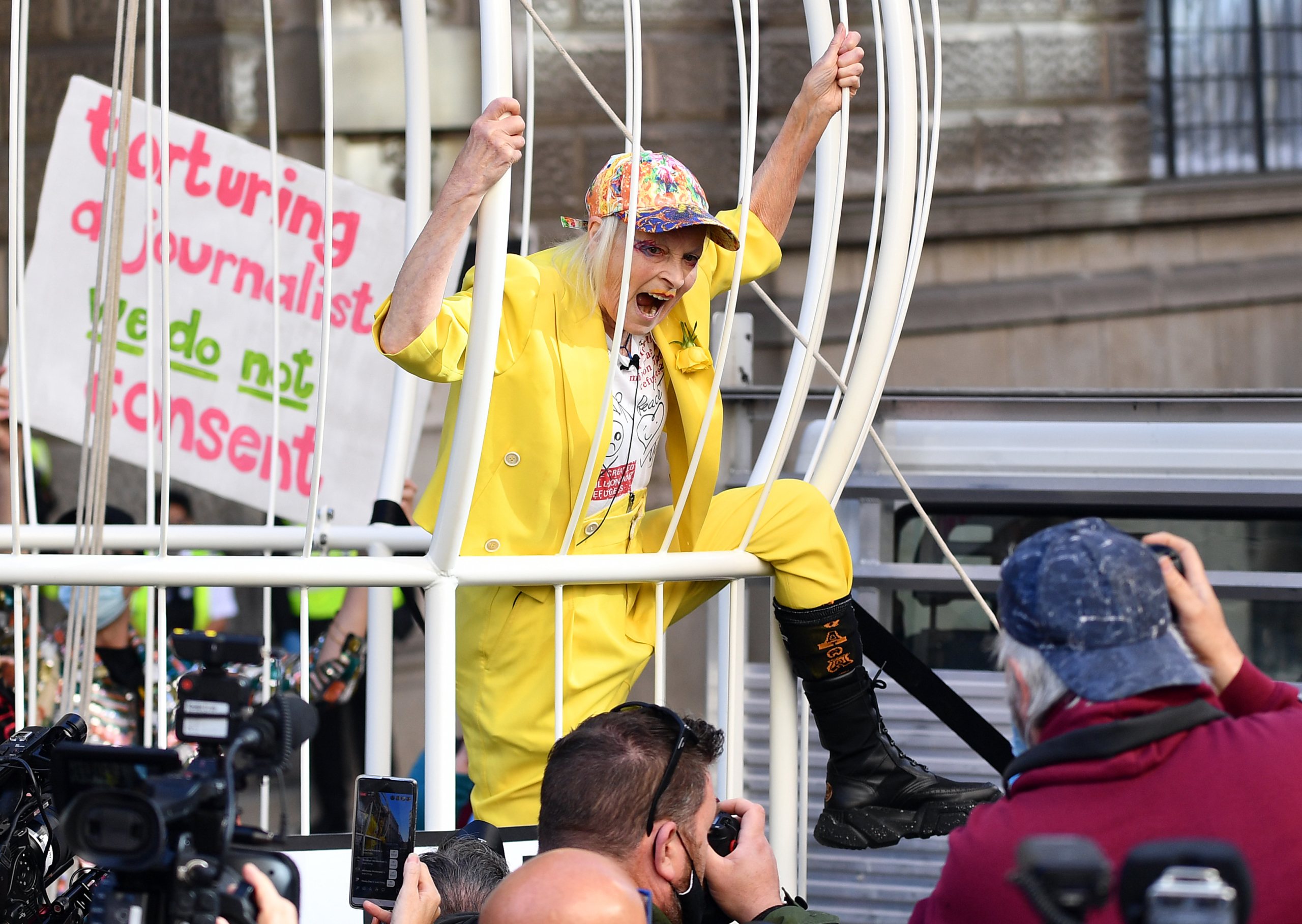 Dame Vivienne Westwood Suspends 10 Ft High Inside Giant Bird Cage In Protest For Julian Assange