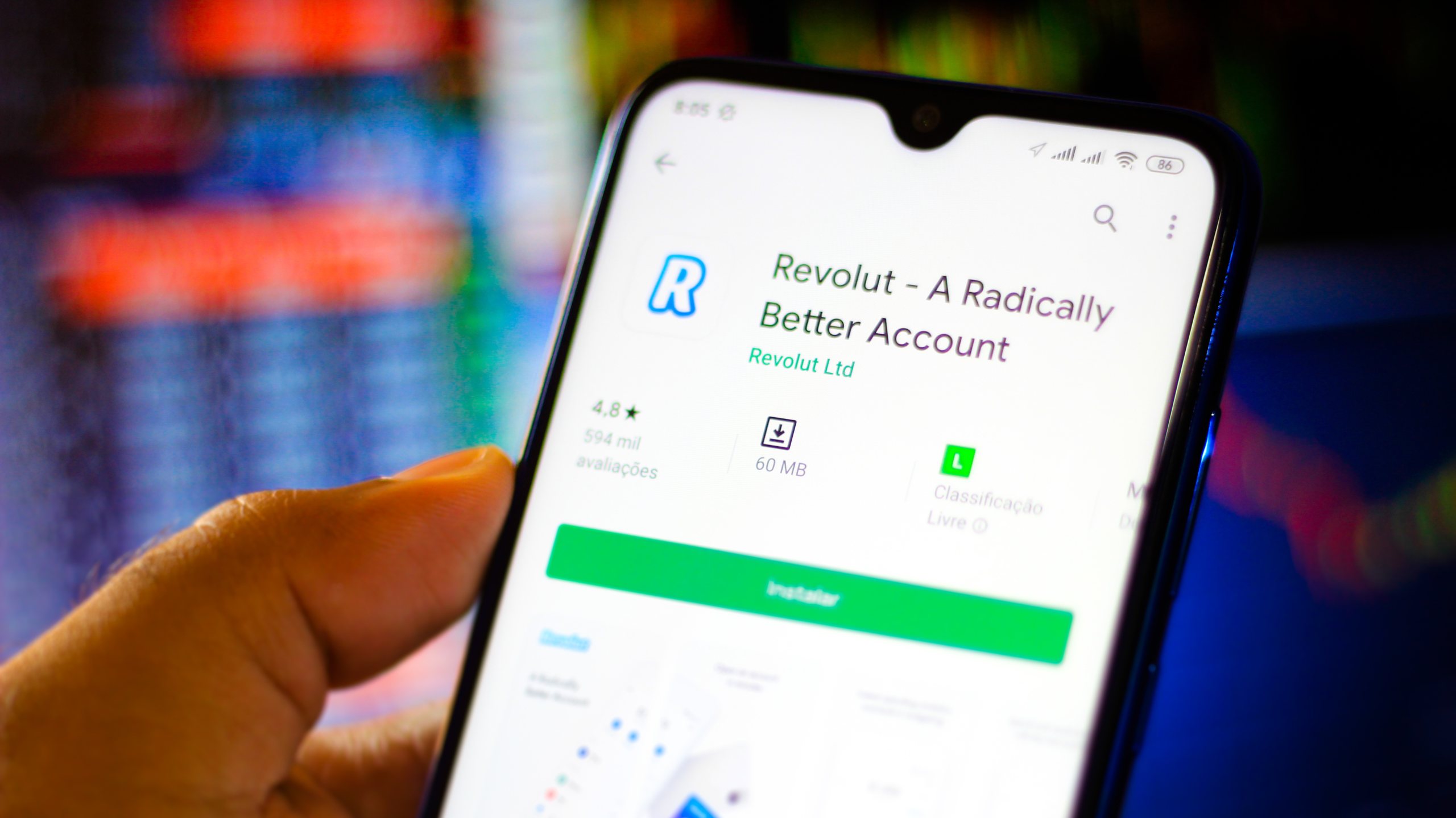 In this photo illustration the Revolut app and logo is seen