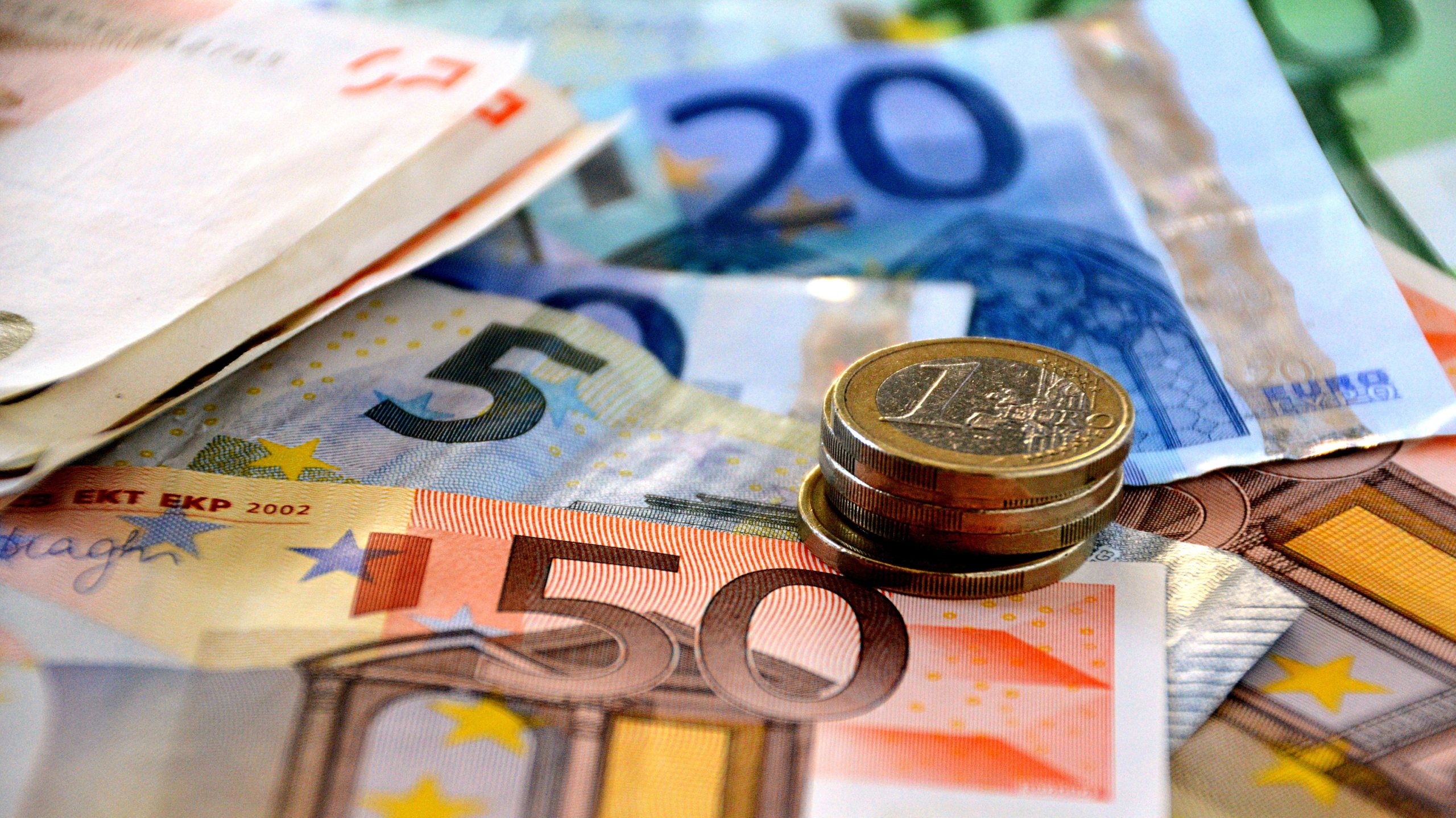 In this photo illustration the Euro banknotes and coins are