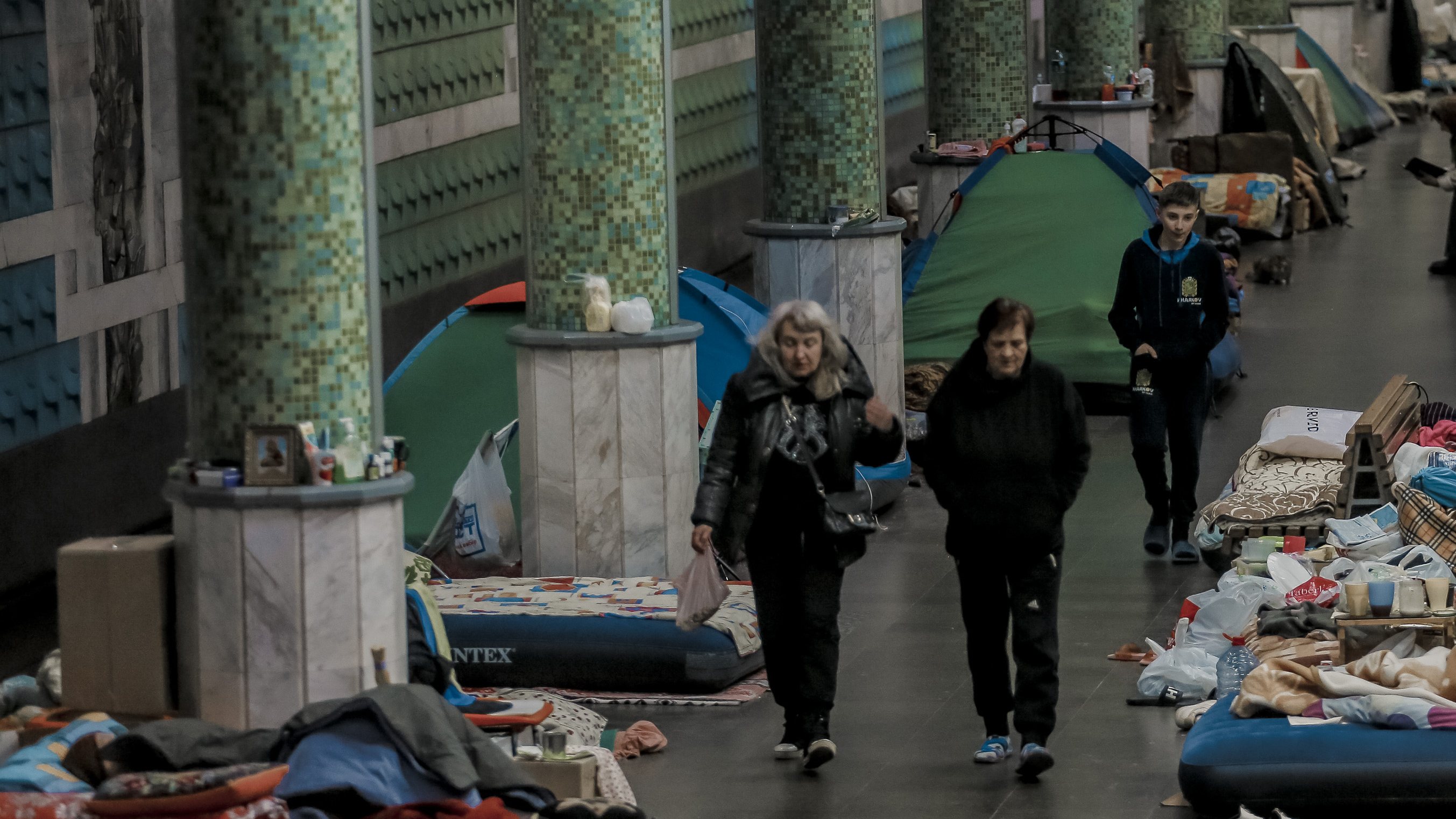 Ukrainians seen in the metro station after fleeing amid