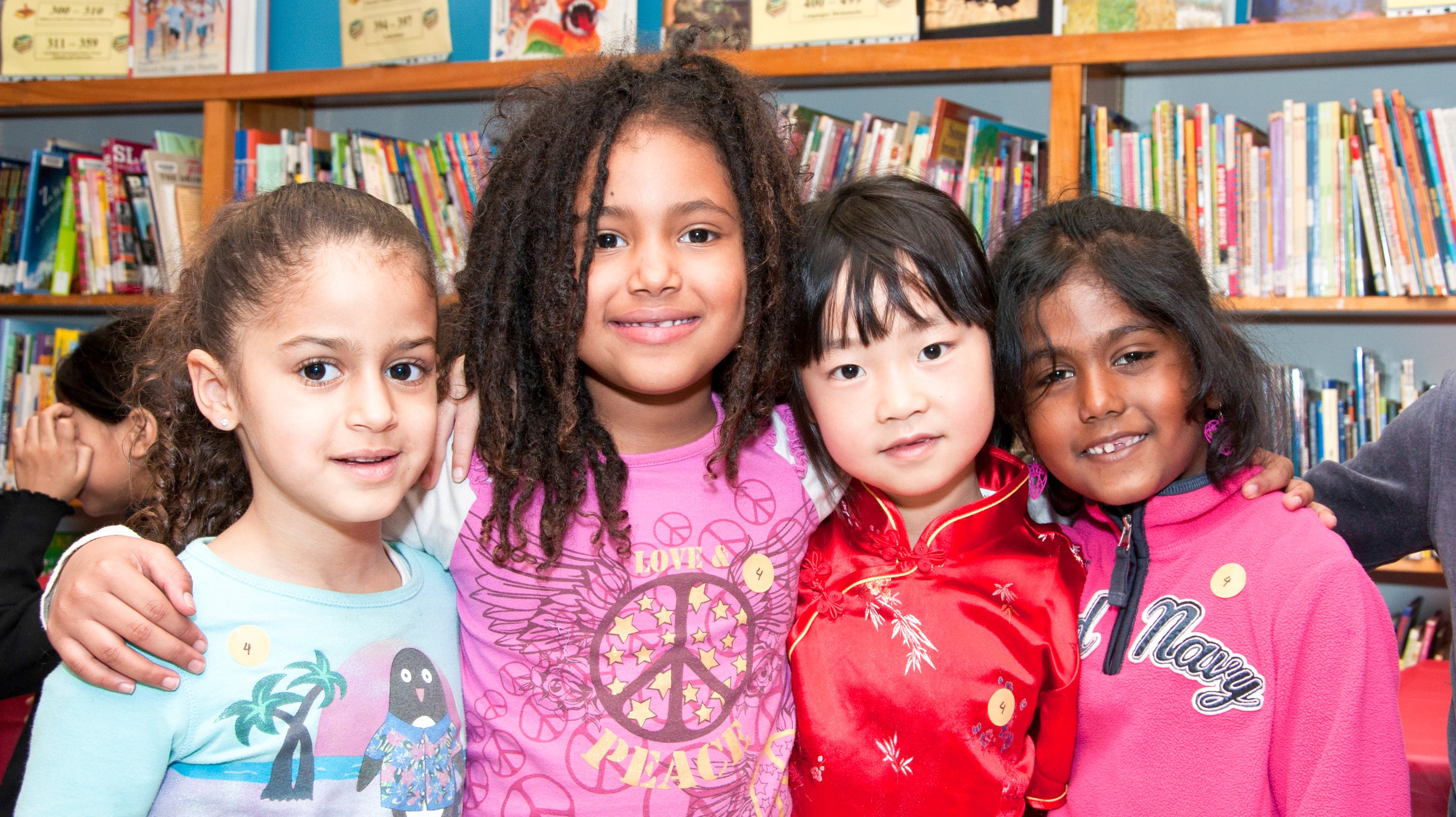 Multicultural children in public school: Happy child girl