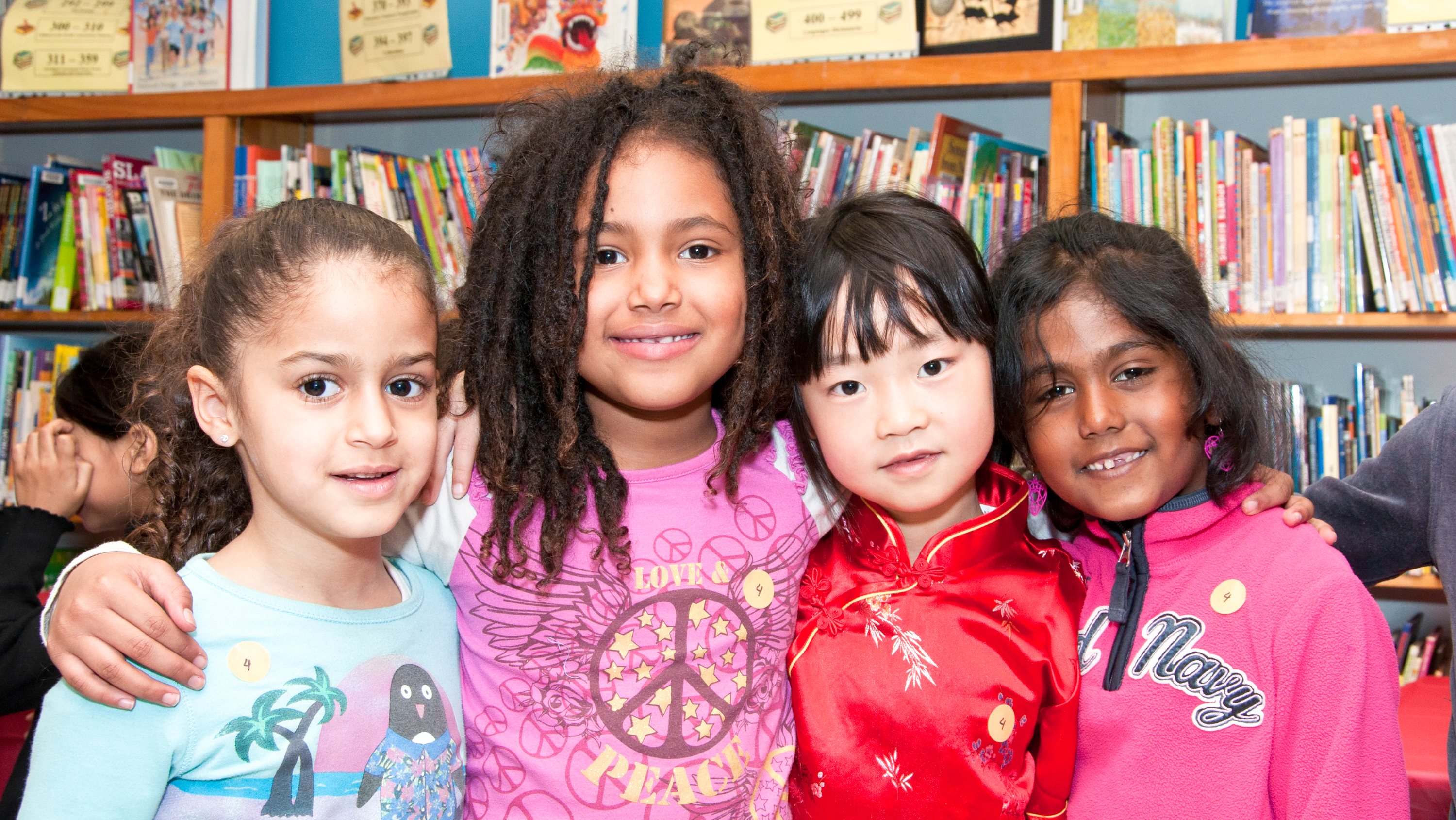 Multicultural children in public school: Happy child girl