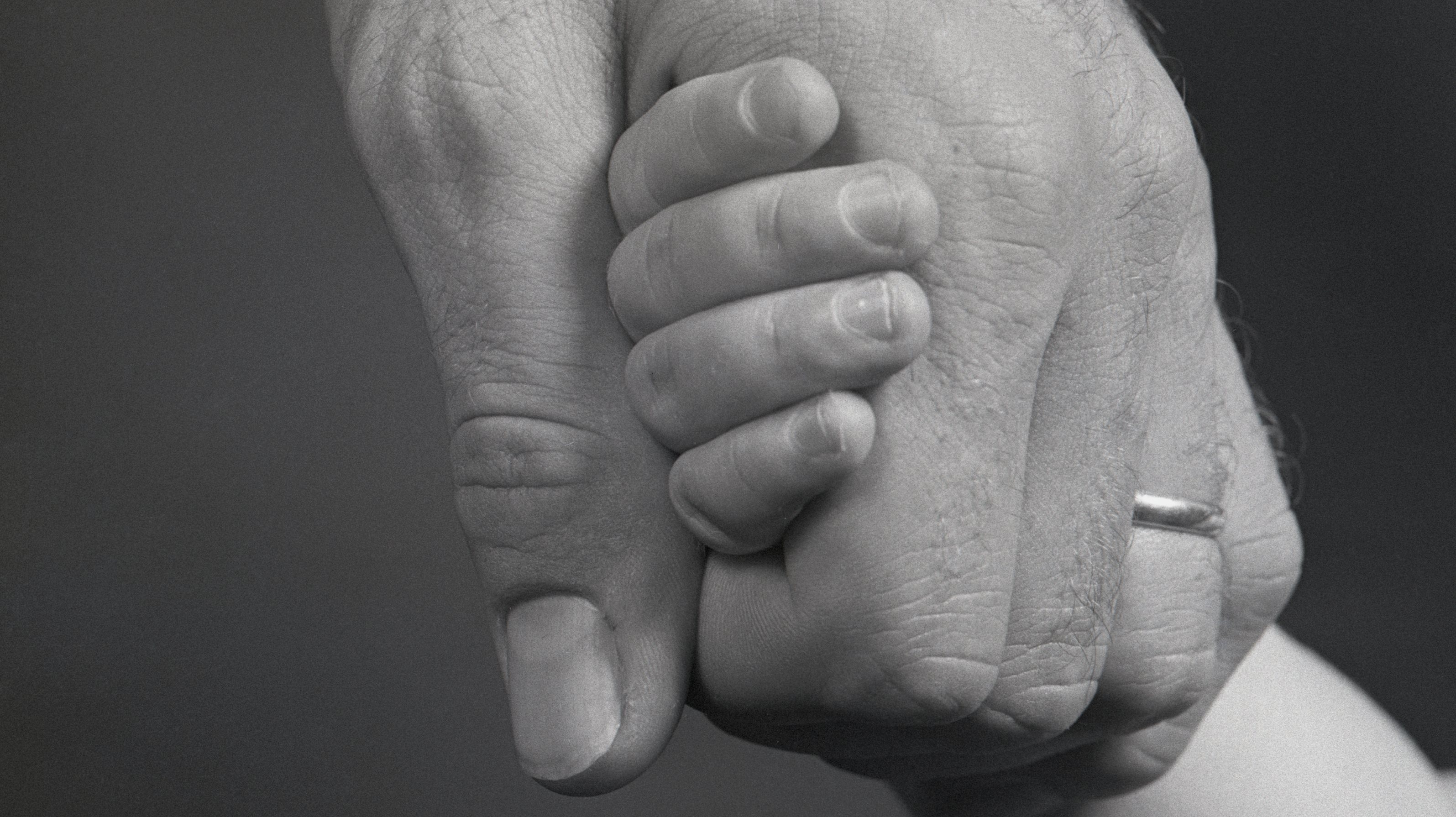 Man Holding Child&#039;s Hand