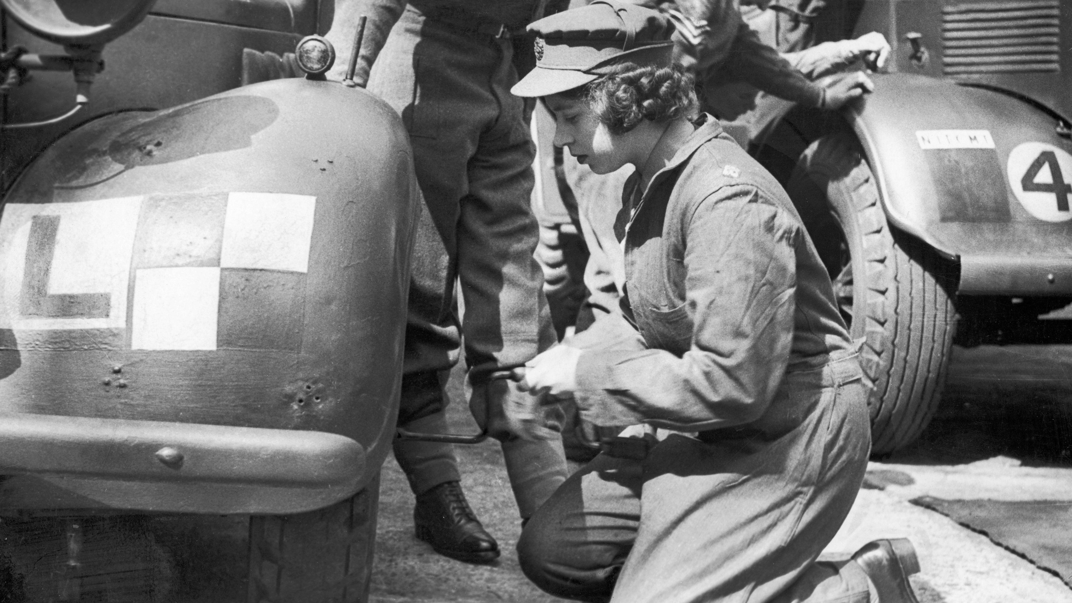 Princess Elizabeth learning basic car maintenance as a Second Subaltern in the A.T.S 12th April 1945.