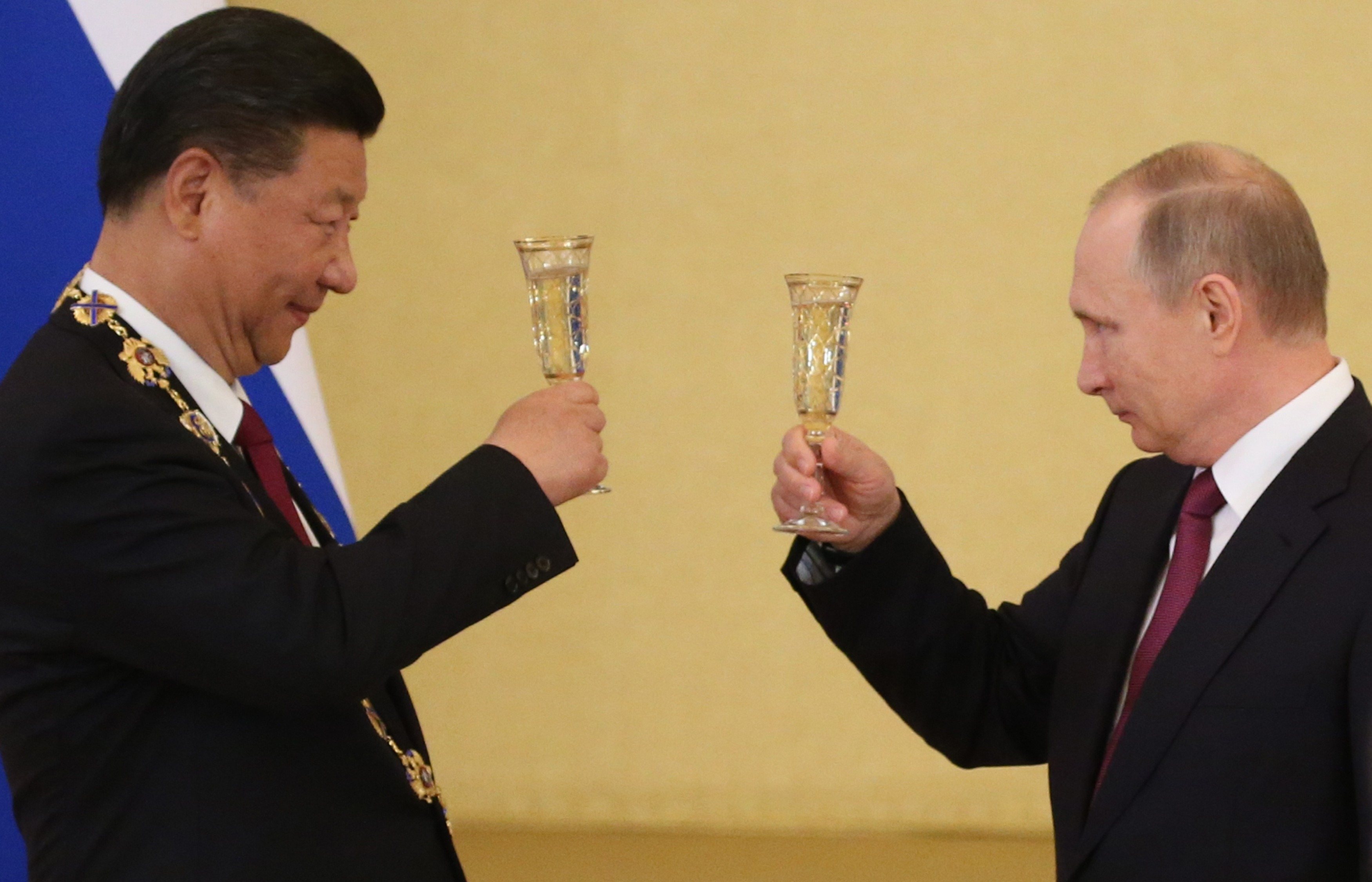 Russian President Vladimir Putin receives Chinese President Xi Jinping in Moscow