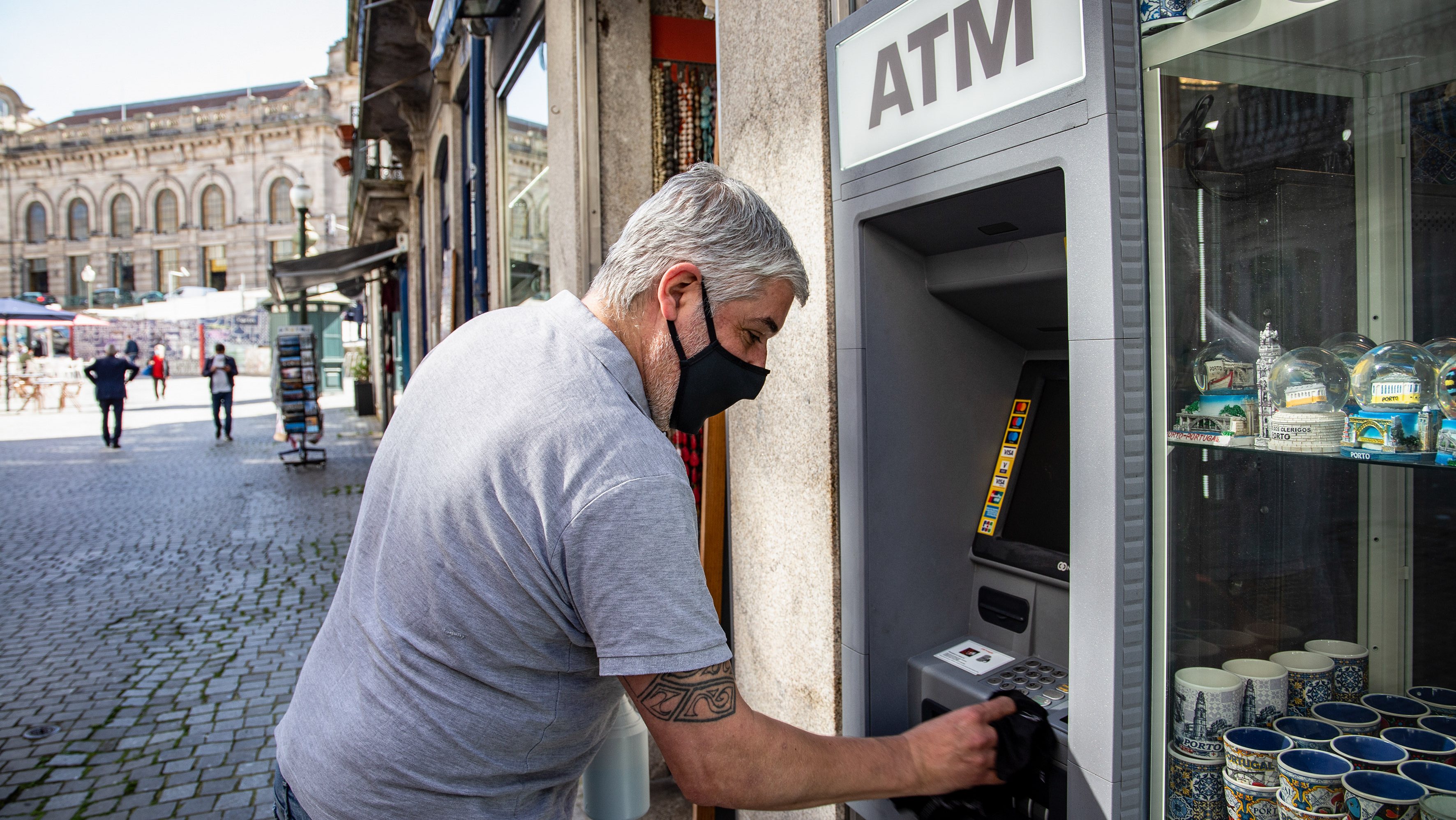 A man seen disinfecting an ATM machine, due to the covid-19