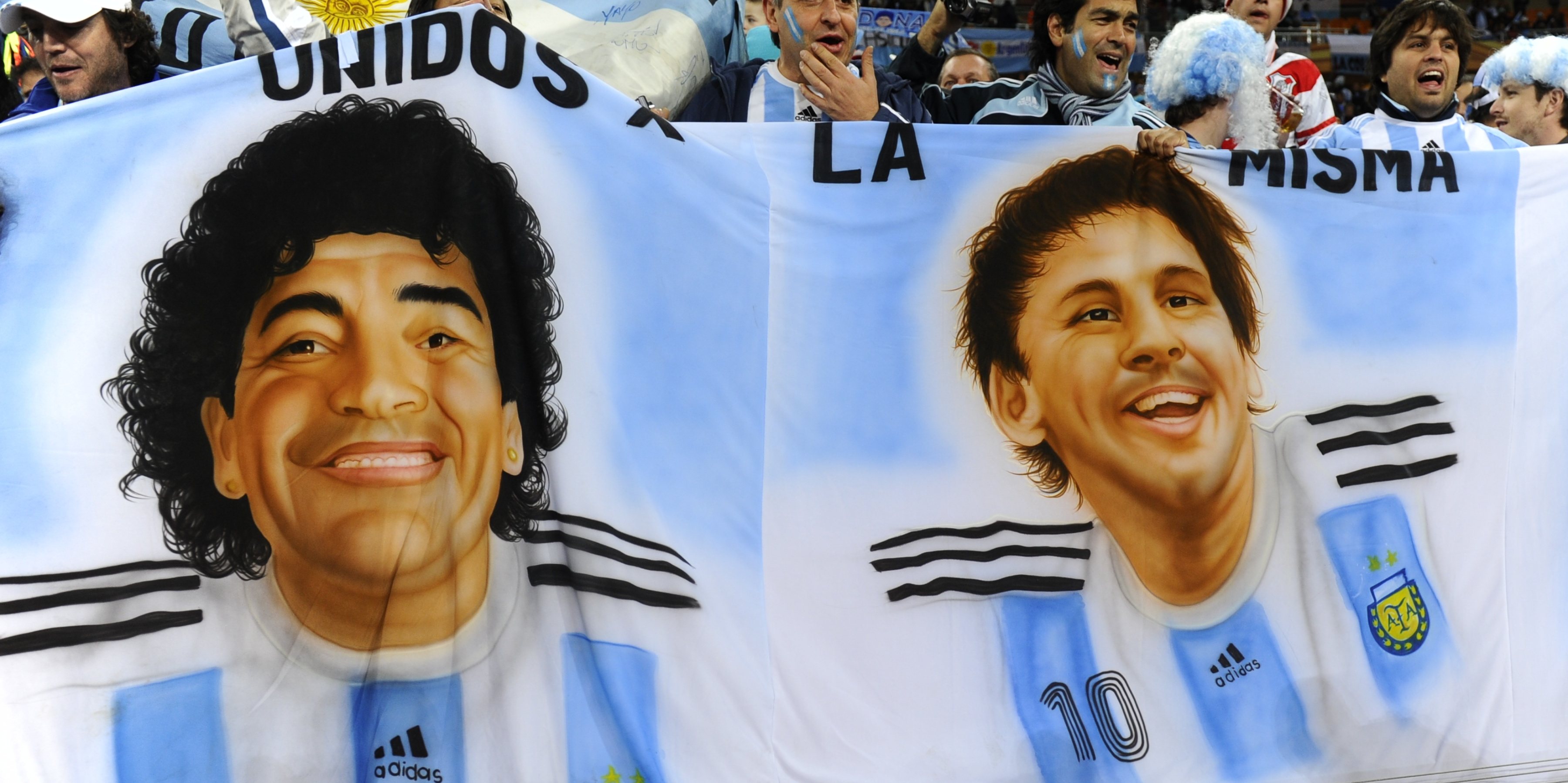 Argentina supporters hold a banner showi