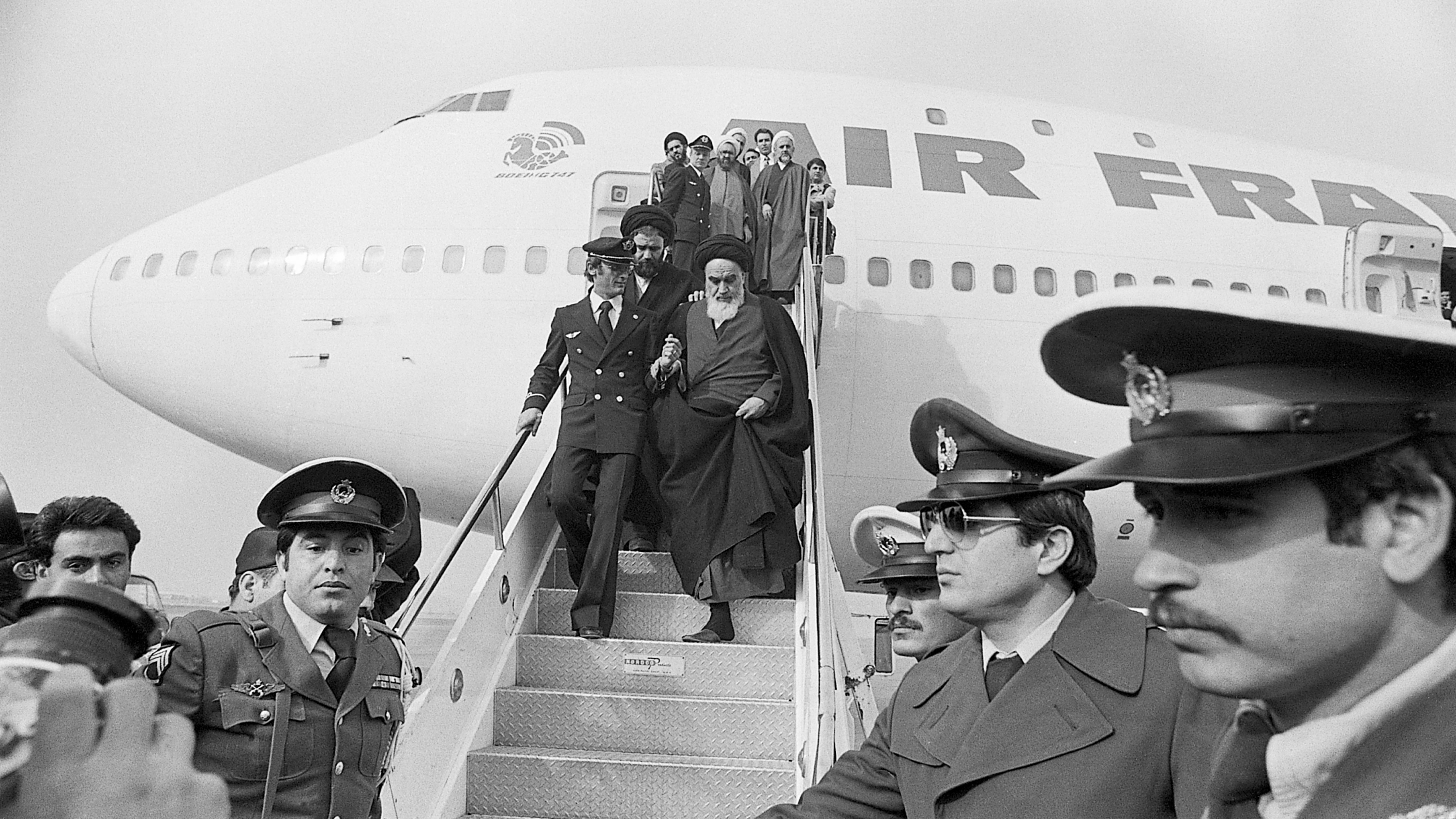 Ayatollah Khomeini Stepping Down from Plane