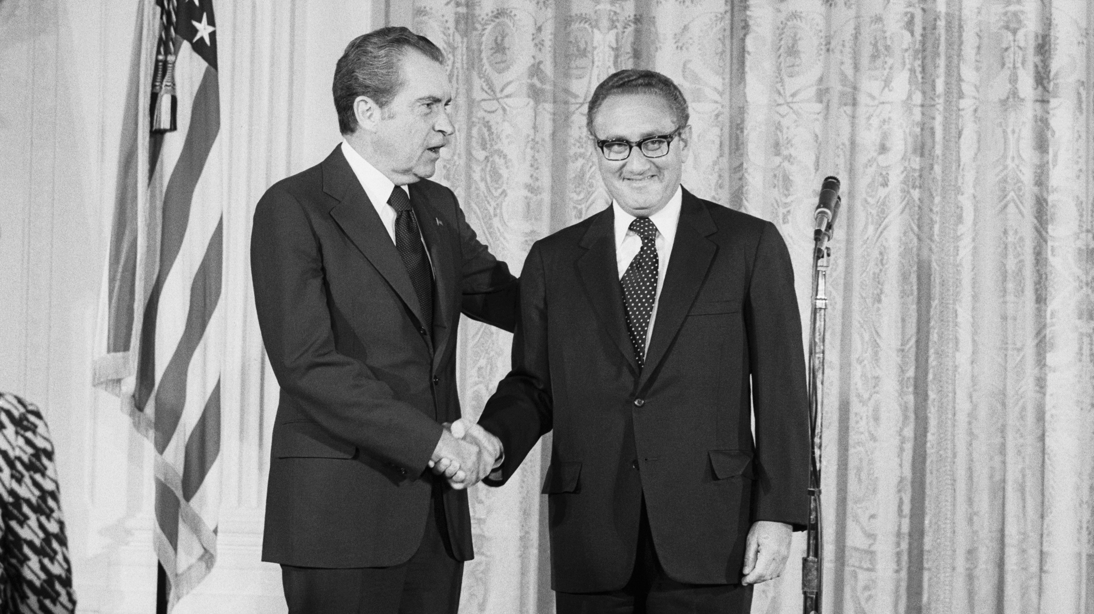 Nixon Shakes Hands with Kissinger