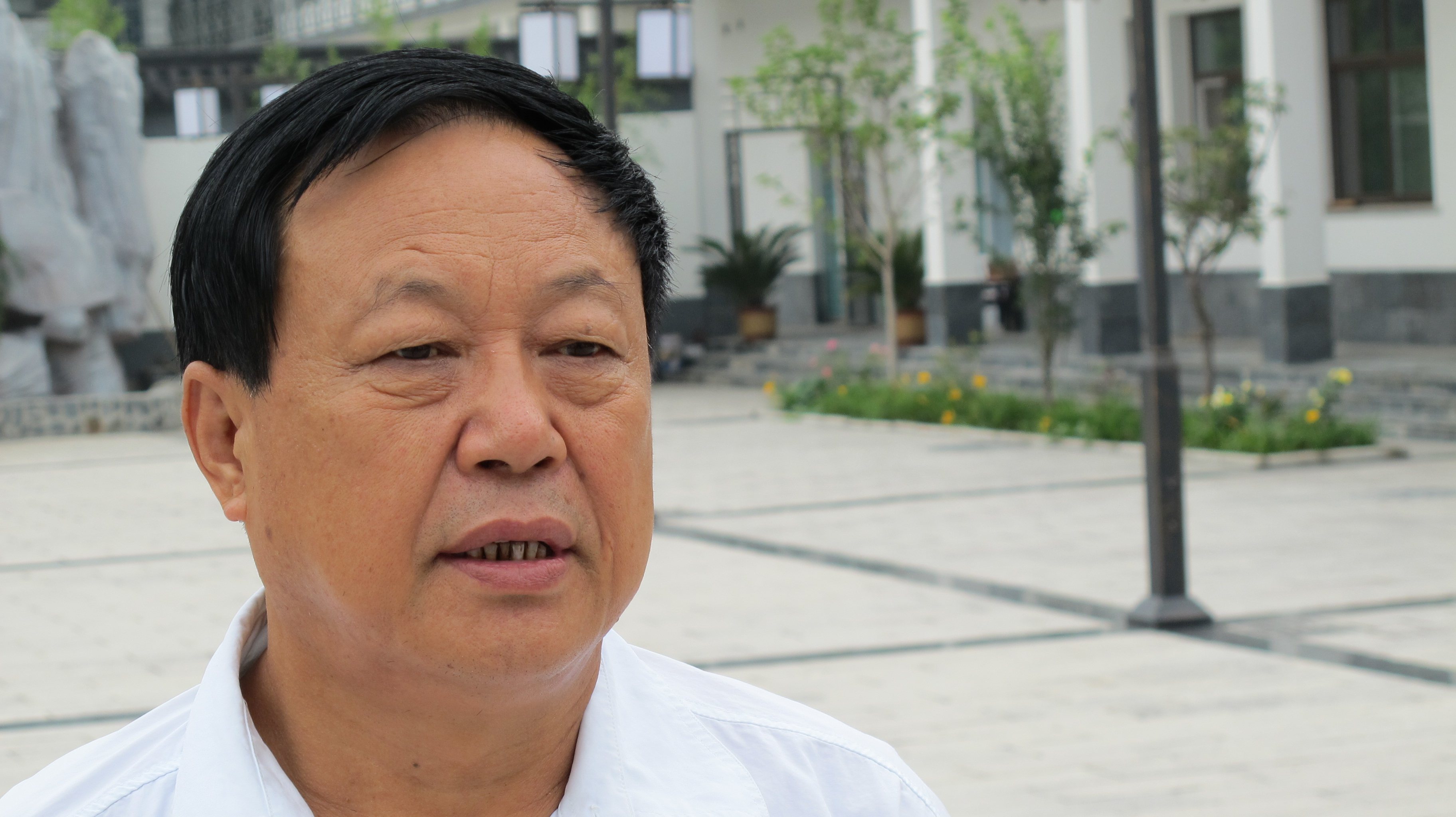 BAODING, CHINA - AUGUST 1: Chinese businessman Sun Dawu talks i