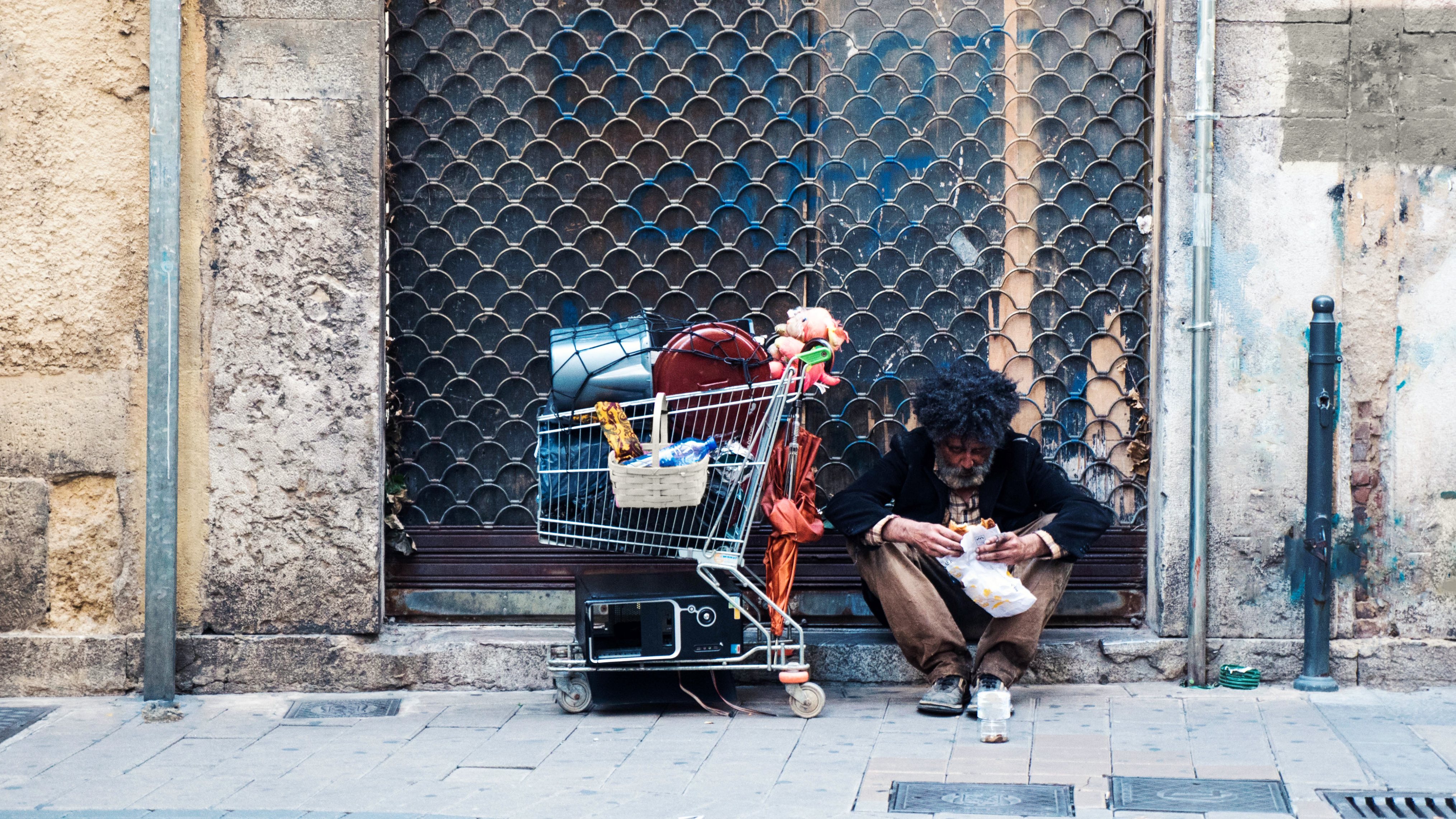 Homeless man asking for money at the street
