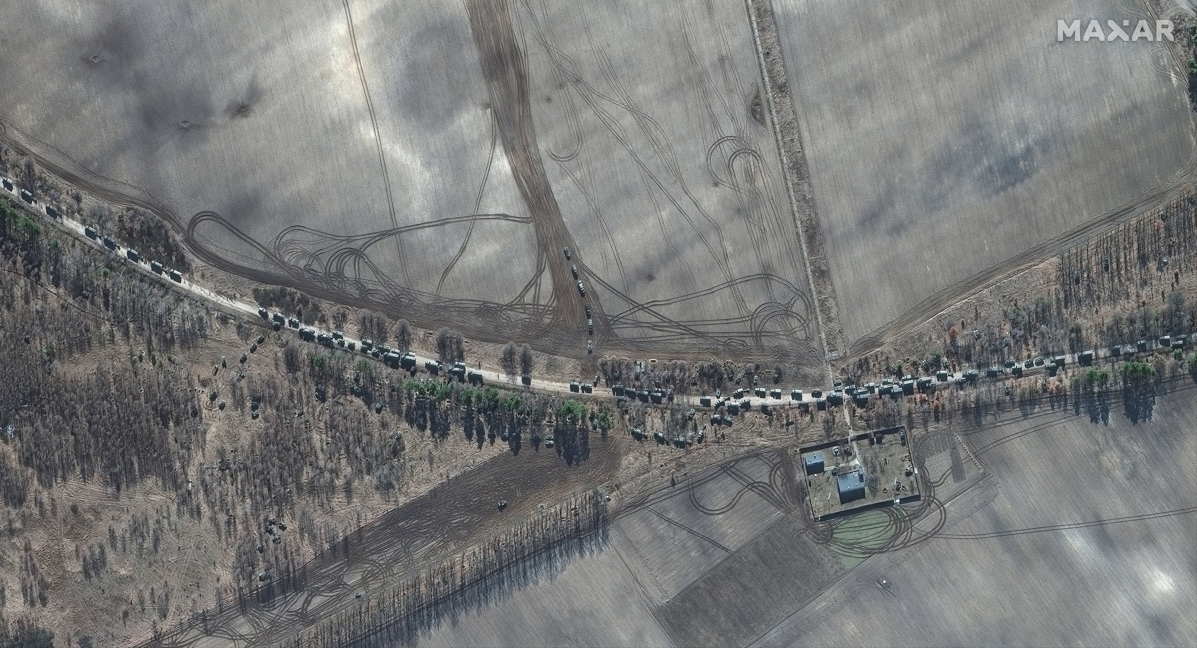 RUSSIANS INVADE UKRAINE -- FEBRUARY 28, 2022:  04 Maxar satellite imagery of southern end of large military convoy on the edge of Antonov Airport.  28feb2022_wv3.   Please use: Satellite image (c) 2022 Maxar Technologies.