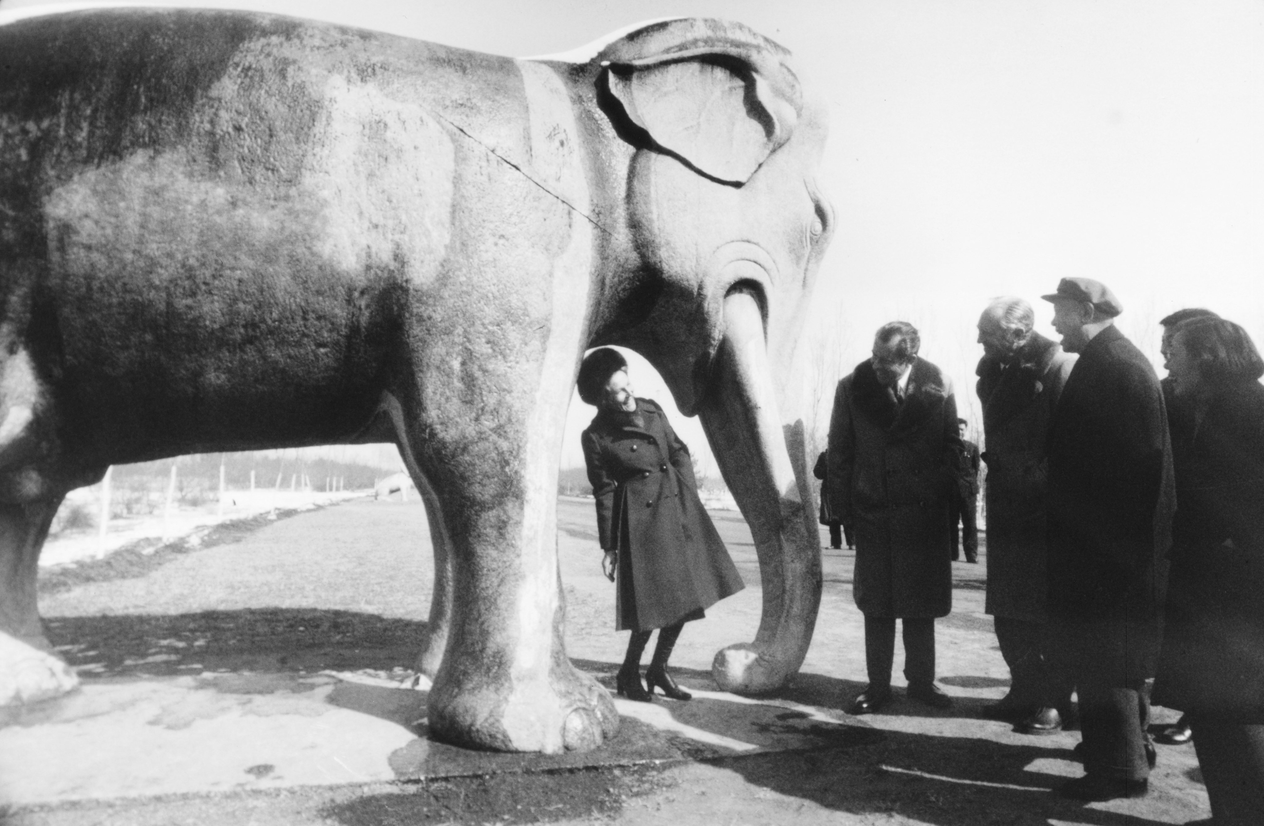 Pat Nixon Standing Under Stone Elephant