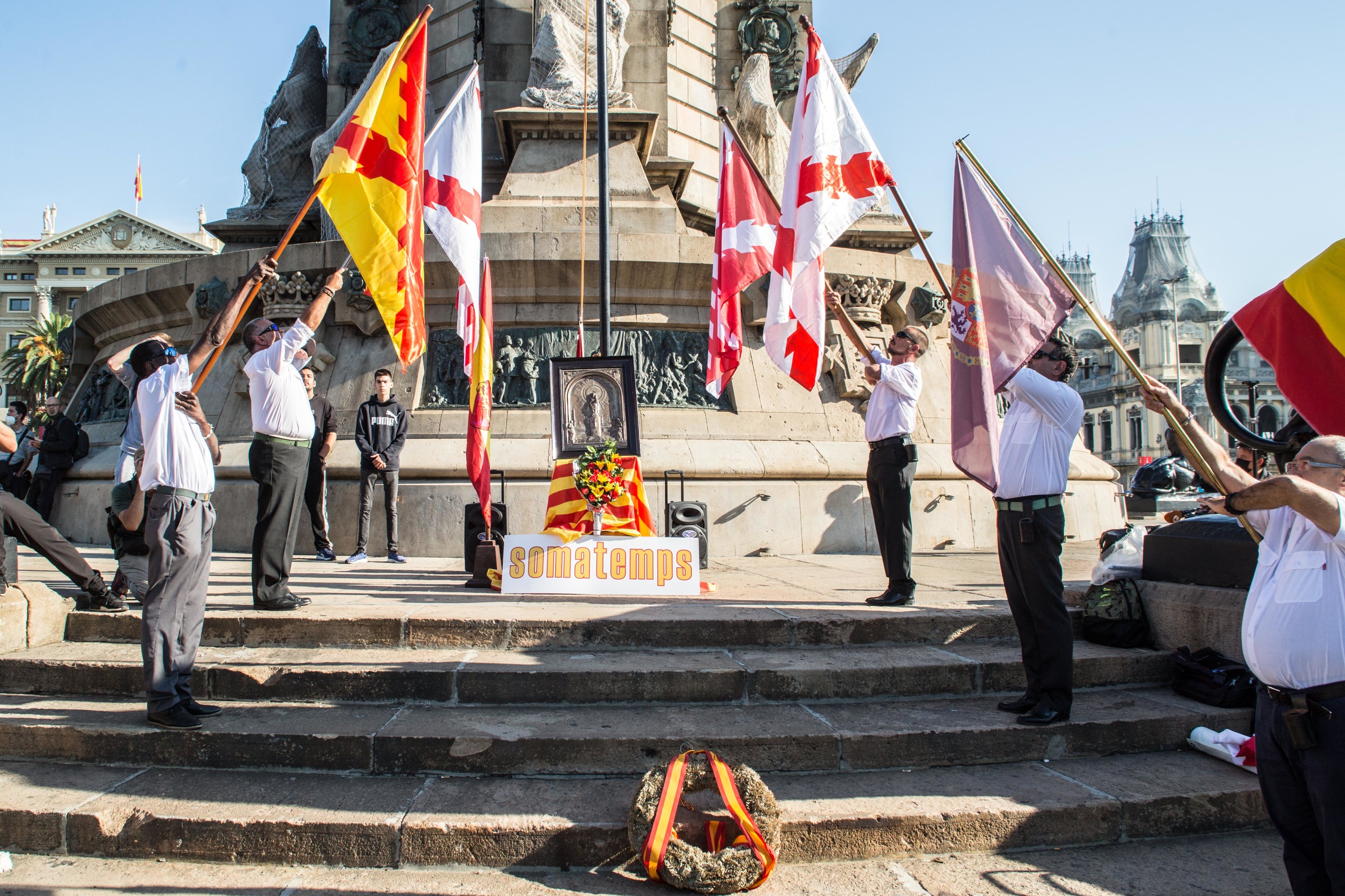 Men seen with flags of the Cross of Burgundy in wreath to