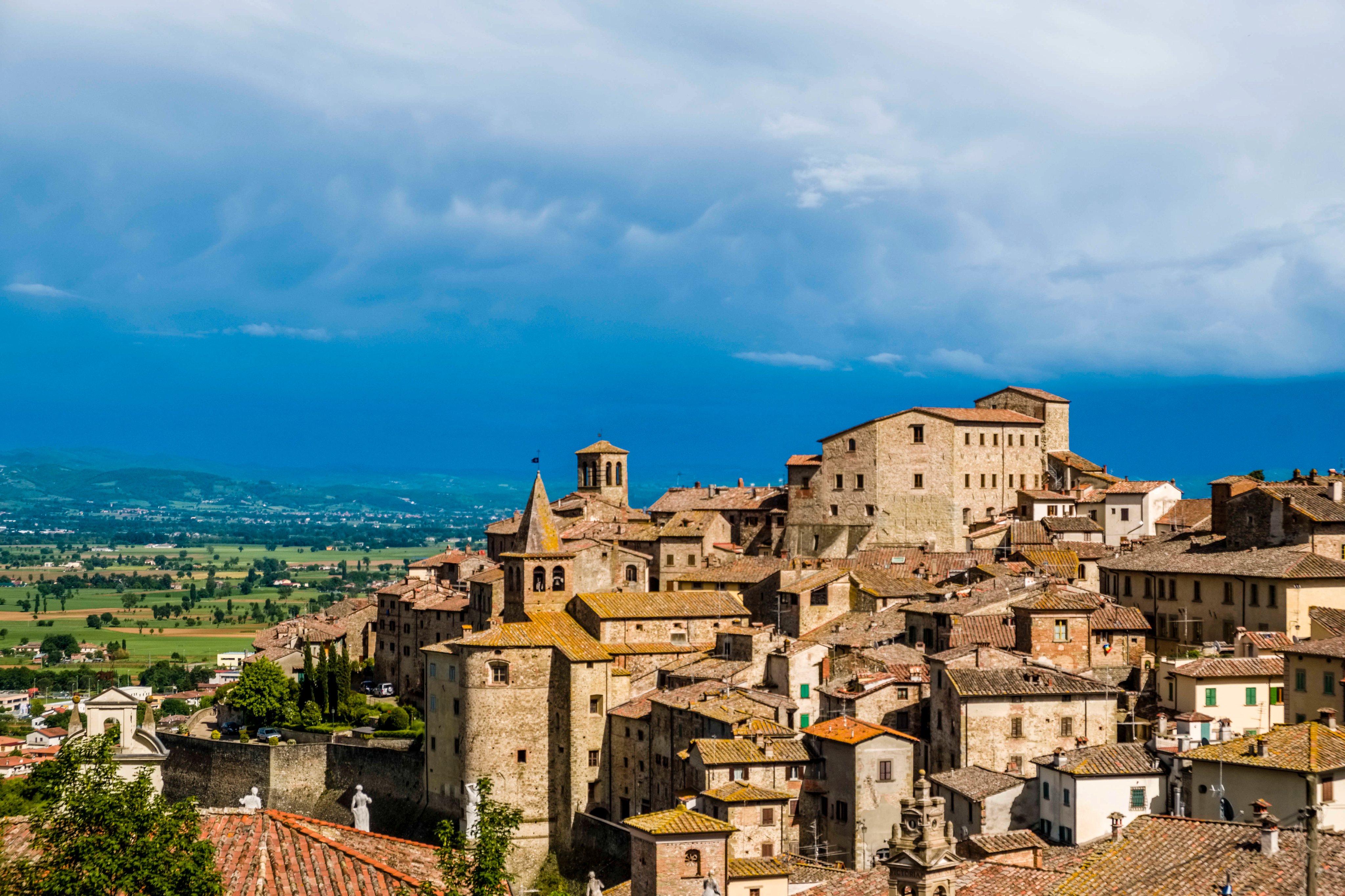 Typical hilly Tuscan countryside with dark thunderstorm