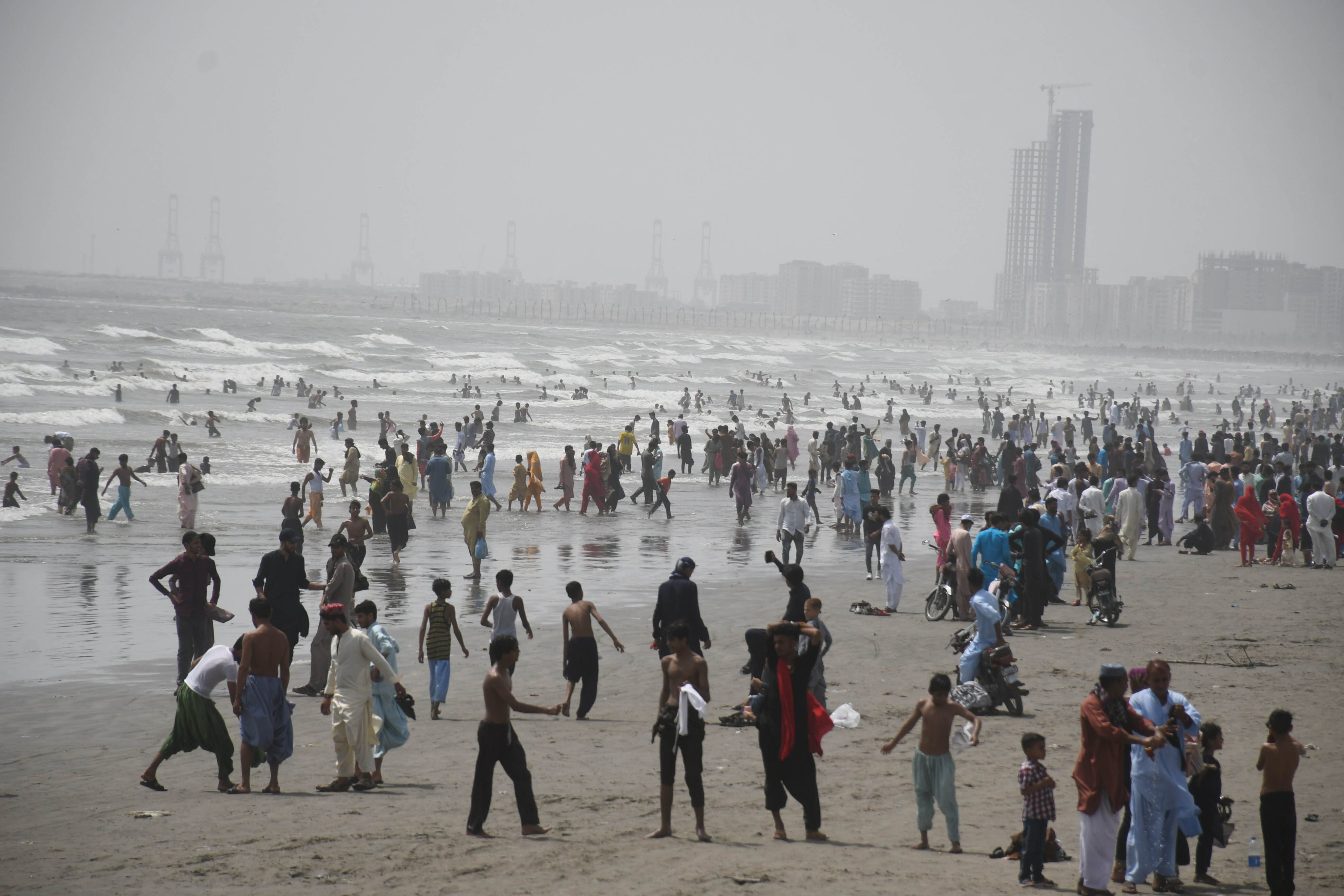 Pakistanis gather at Clifton Beach during Eid-al-Fitr holiday