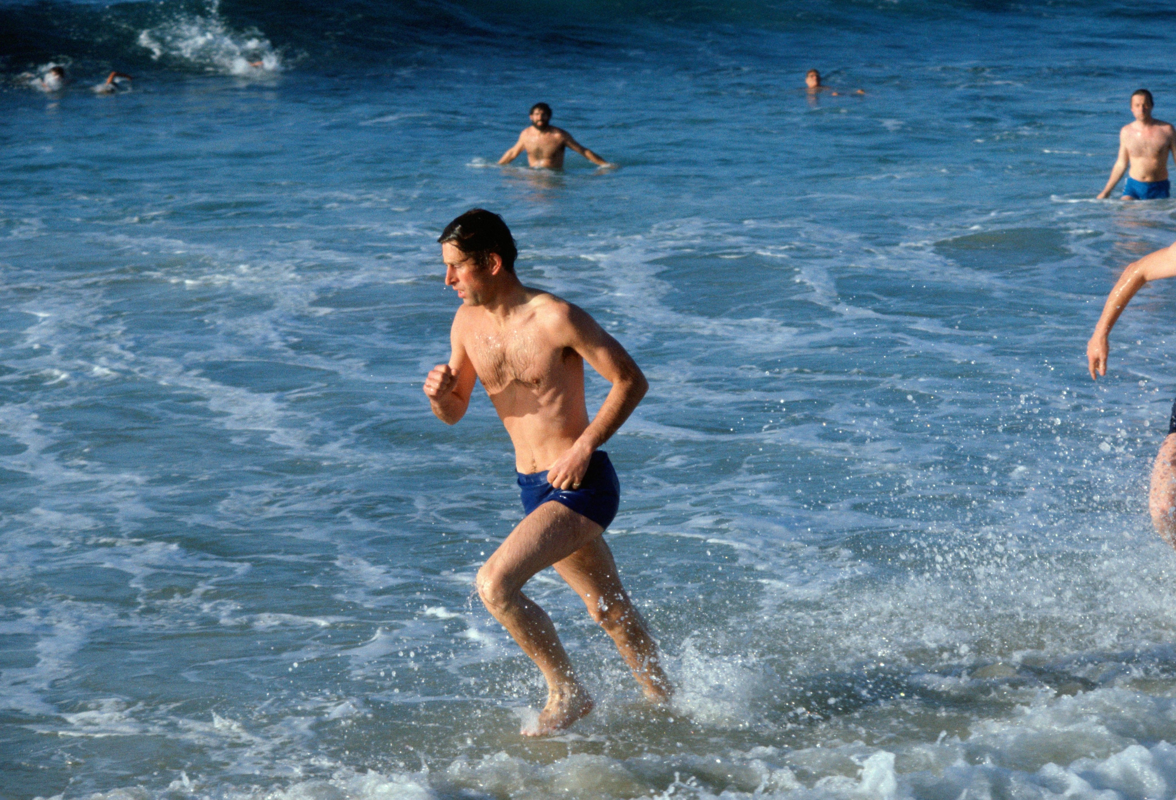 Prince Charles, Prince of Wales in the sea at Bondi Beach as