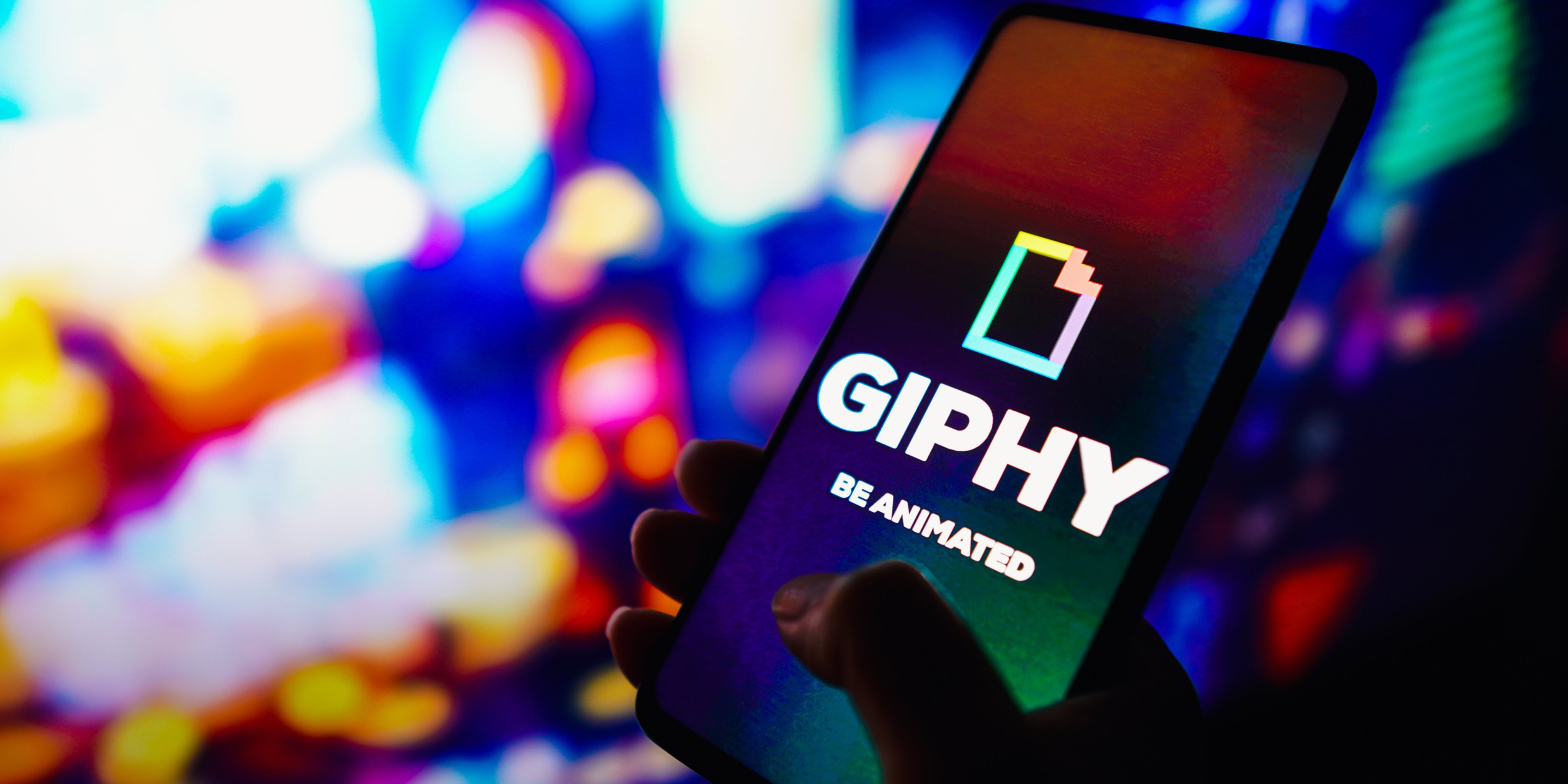 In this photo illustration, the Giphy logo seen displayed on