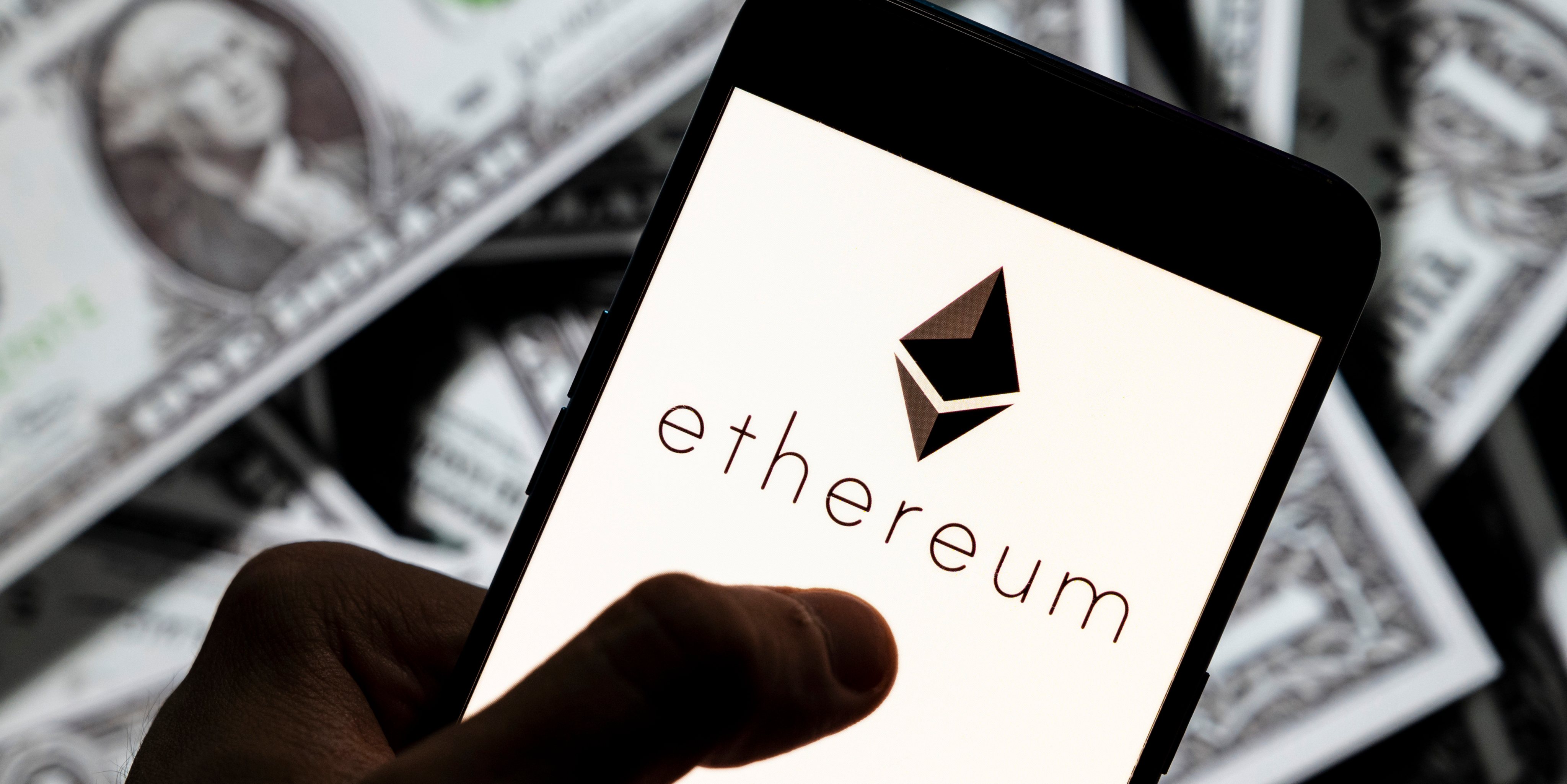 In this photo illustration, an Ethereum logo seen displayed