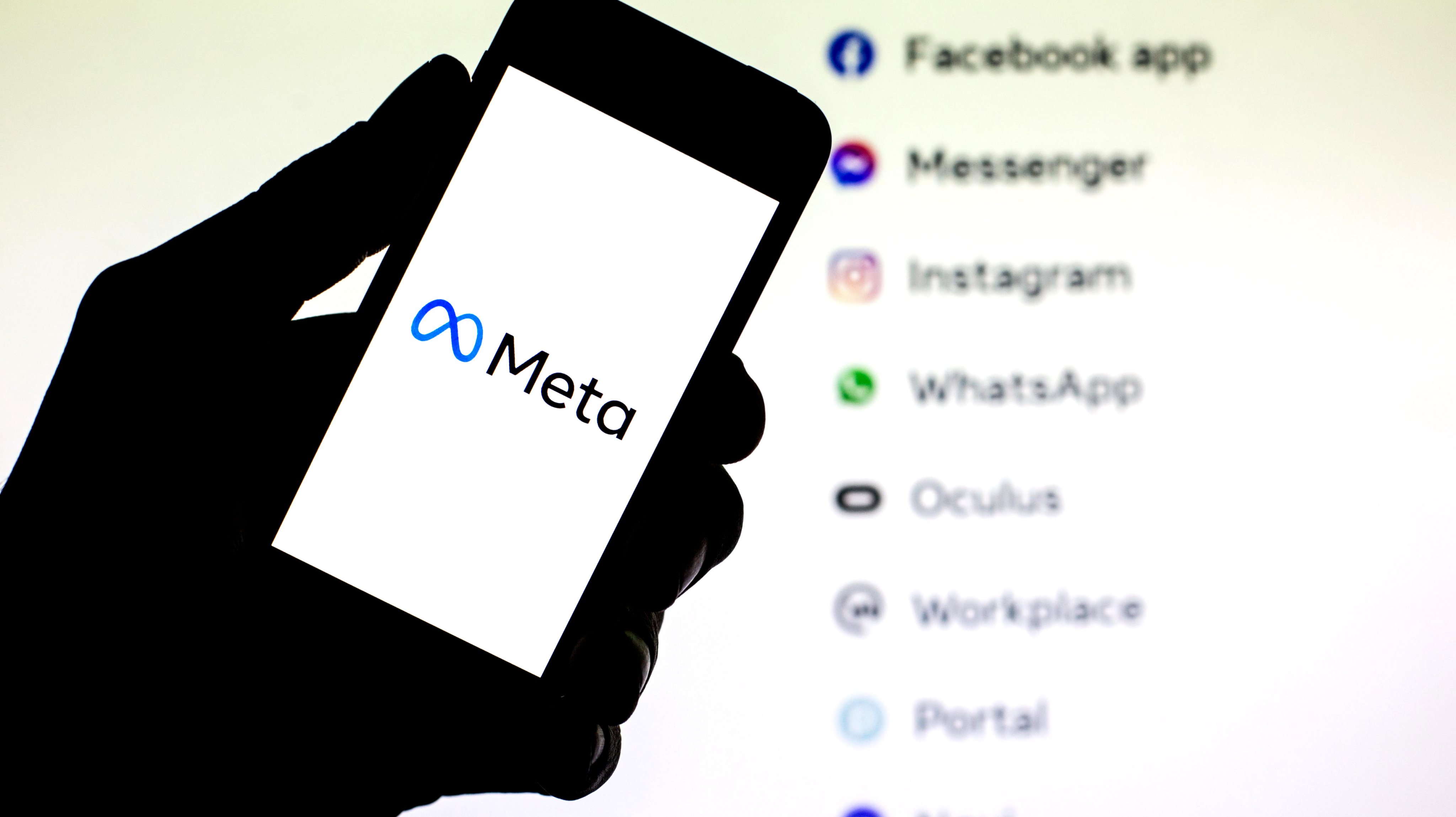 In this photo illustration a Meta logo seen displayed on a
