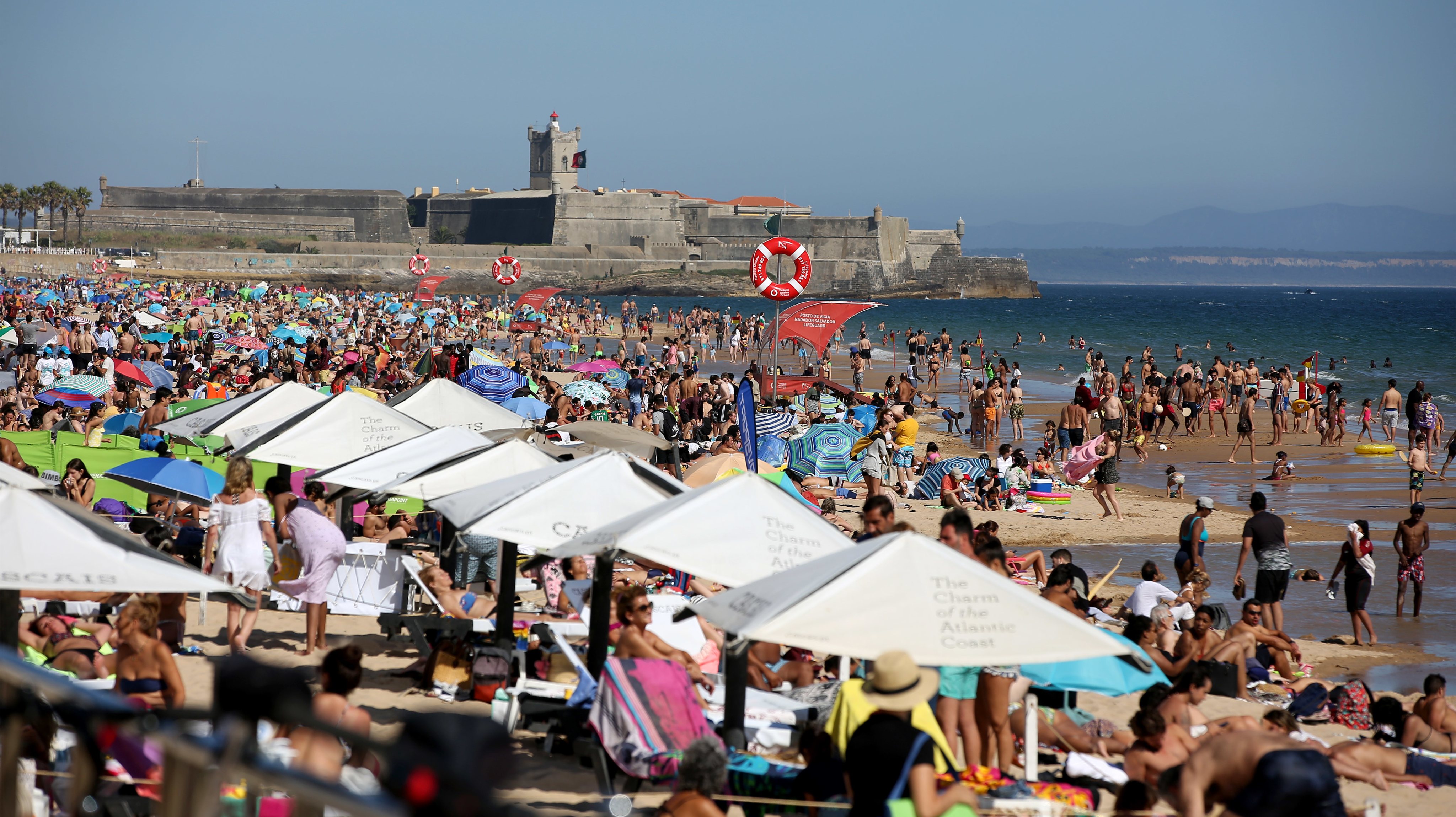 Beachgoers crowd beaches near Lisbon amid COVID-19 pandemic