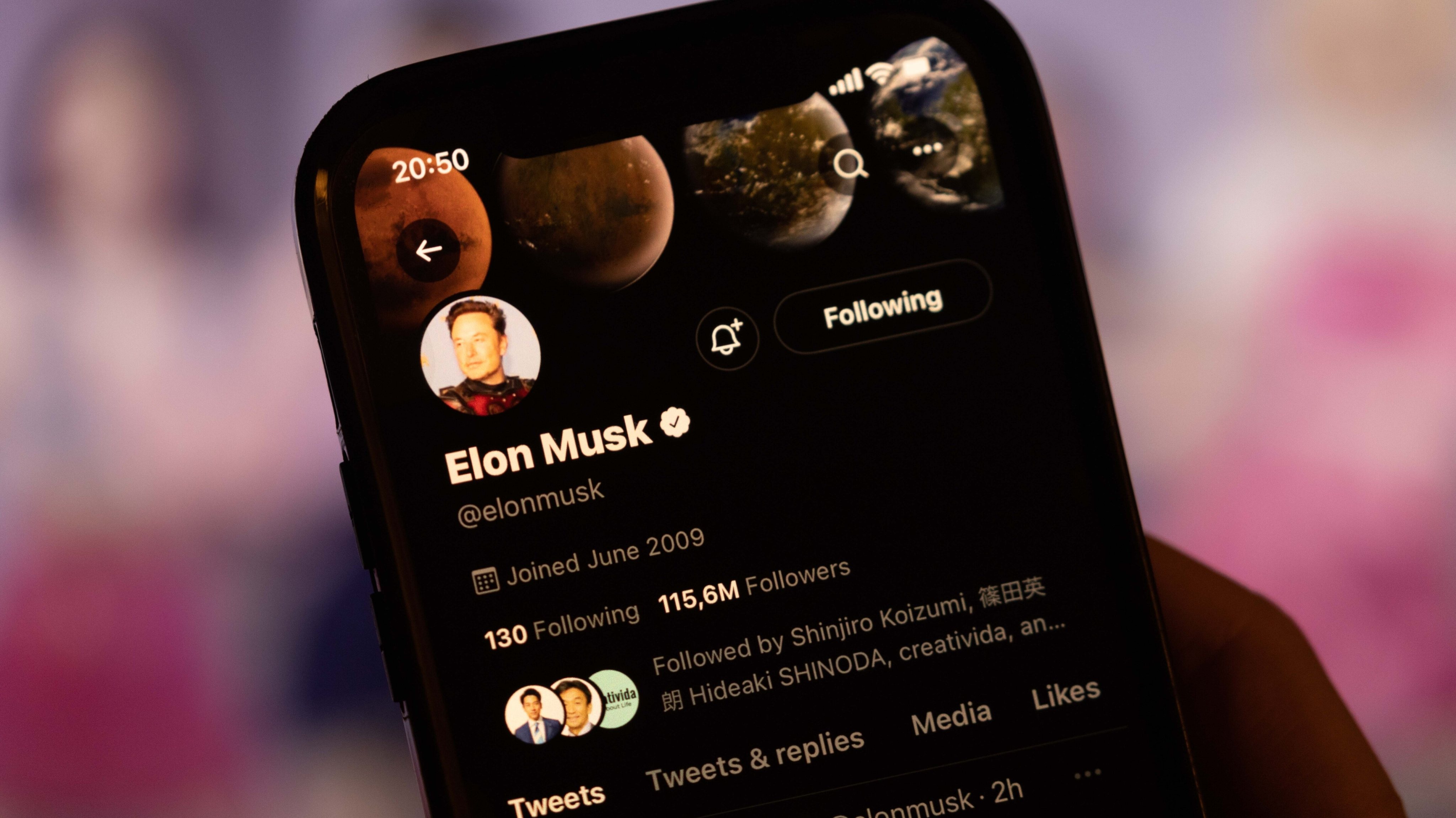 In this photo illustration, Elon Musk&#039;s Twitter account is