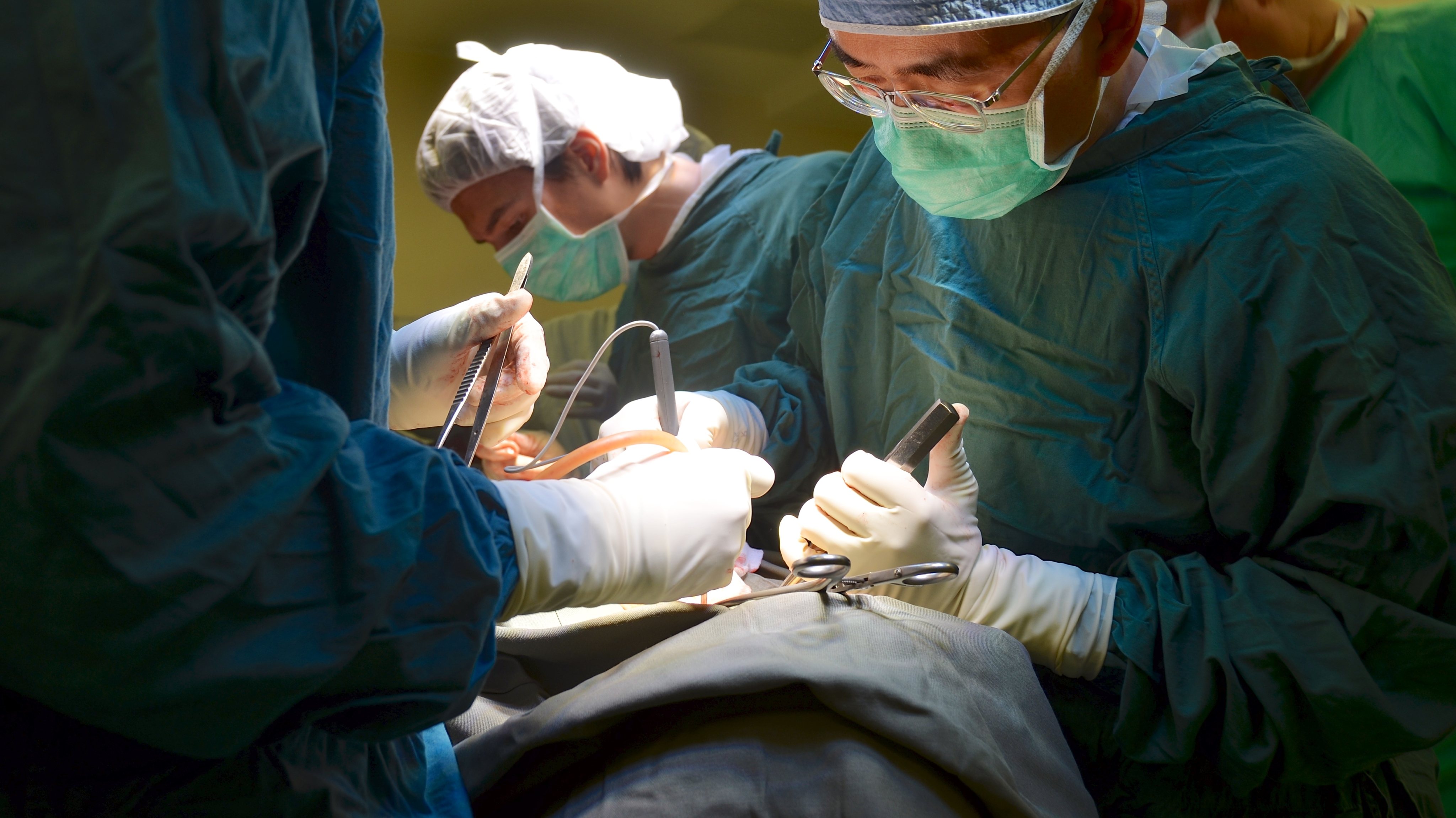 A team of surgeons, headed by Professor Kenneth M.C. Cheung