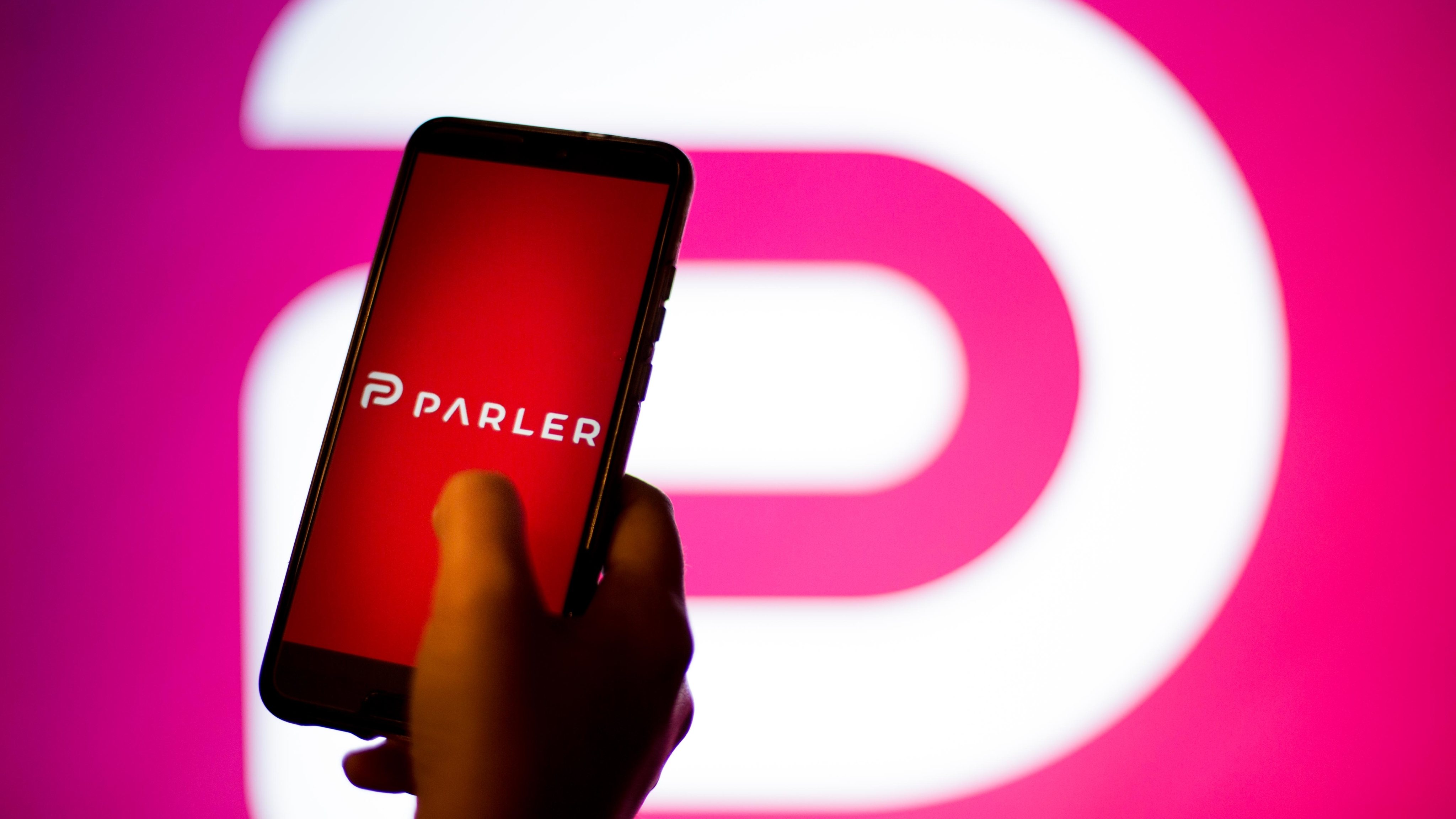In this photo illustration a Parler App and logo is seen
