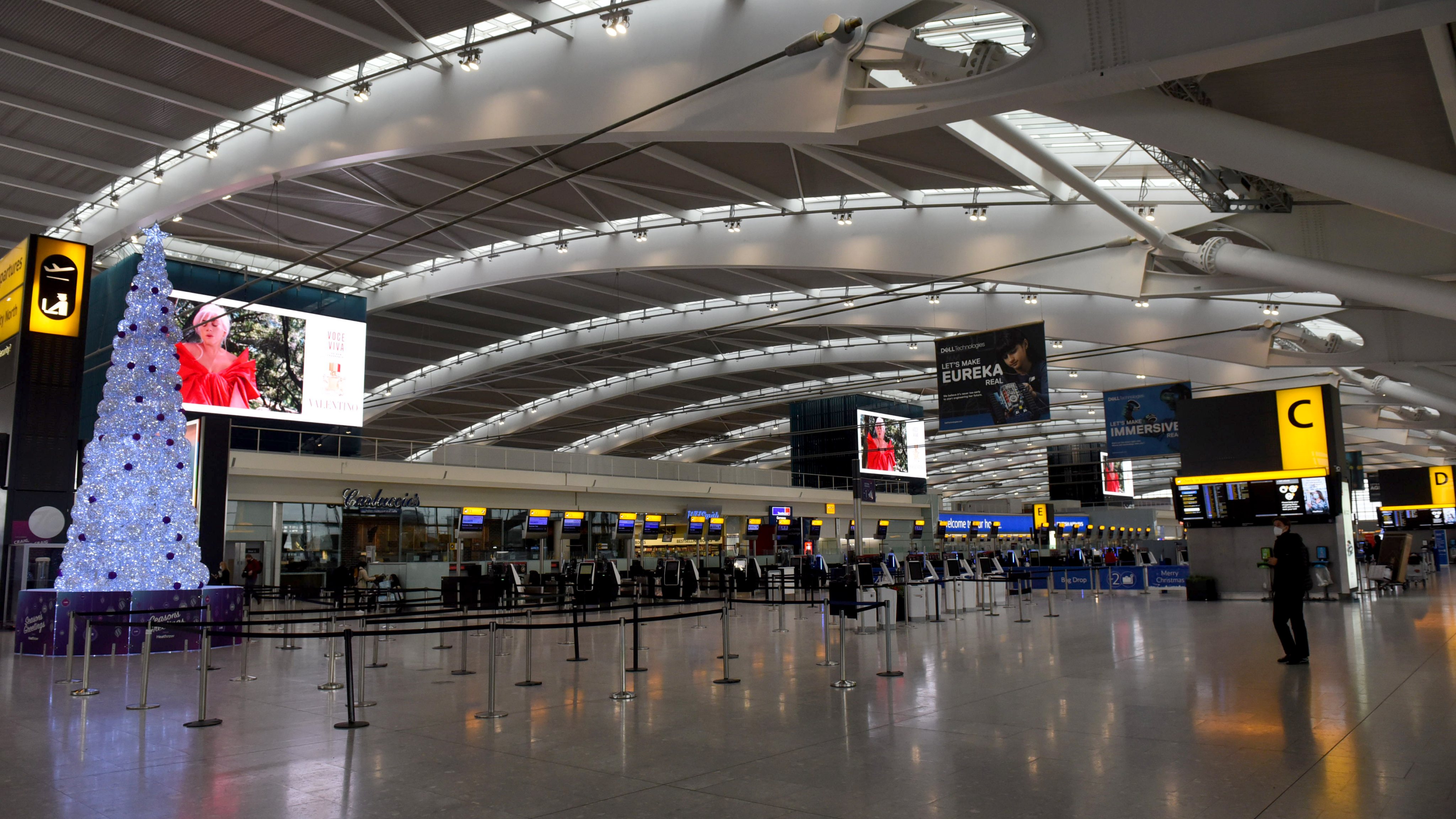 Londoners wait at Heathrow to flee capital as nations bar travelers from UK over new variant of coronavirus