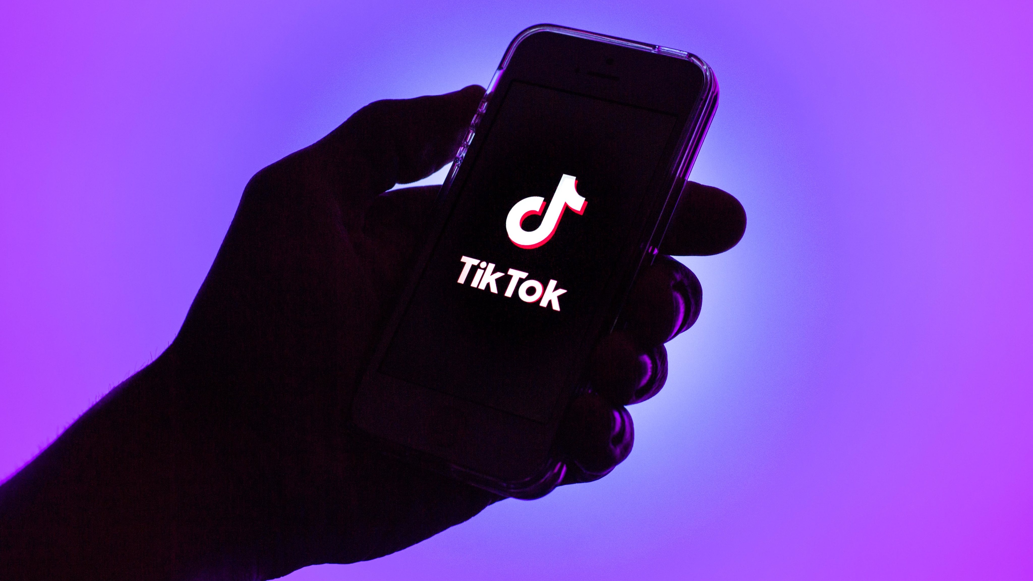 In this photo illustration, a Tik Tok logo seen displayed on