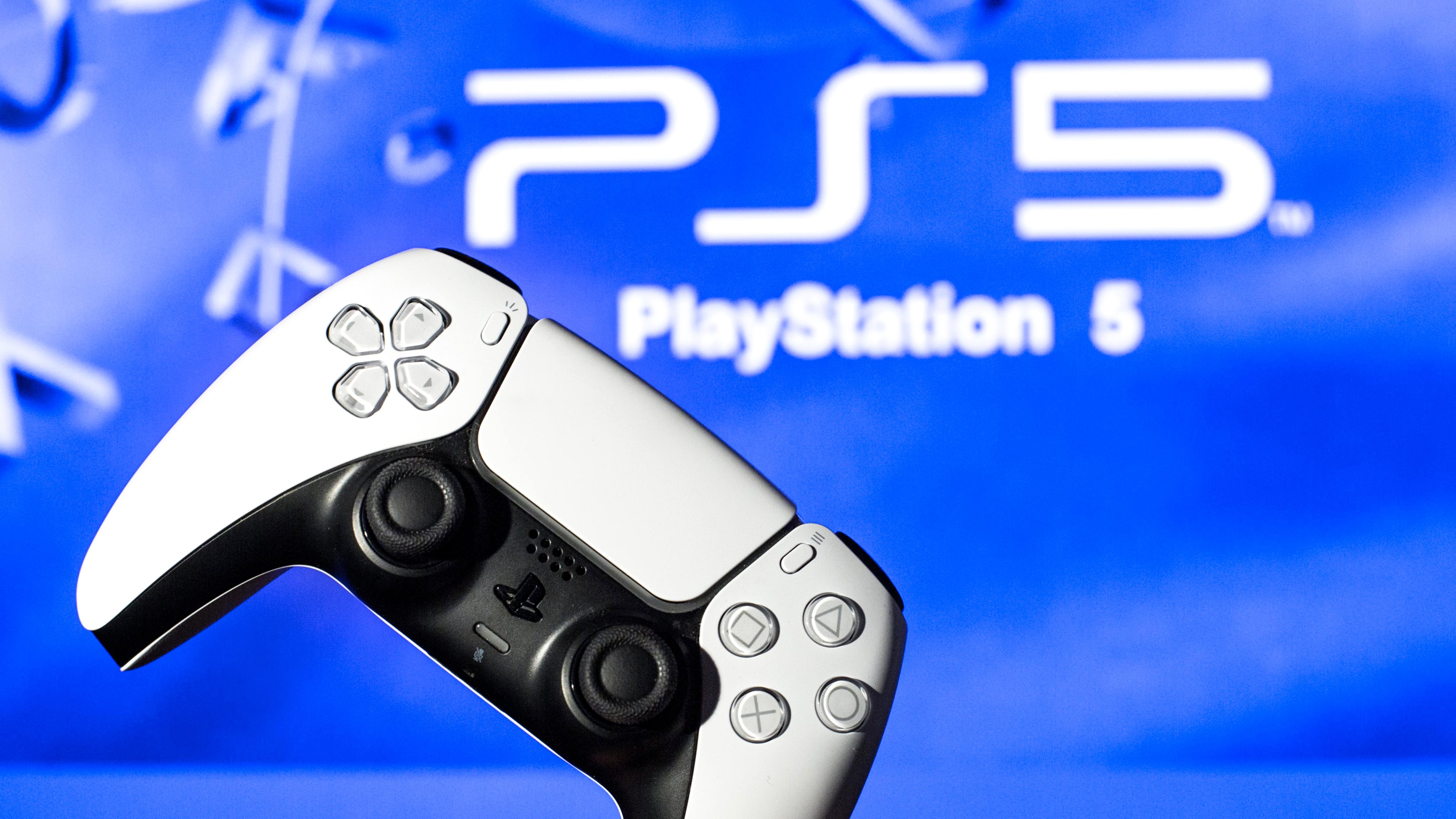 In this photo illustration, a PlayStation 5 controller seen
