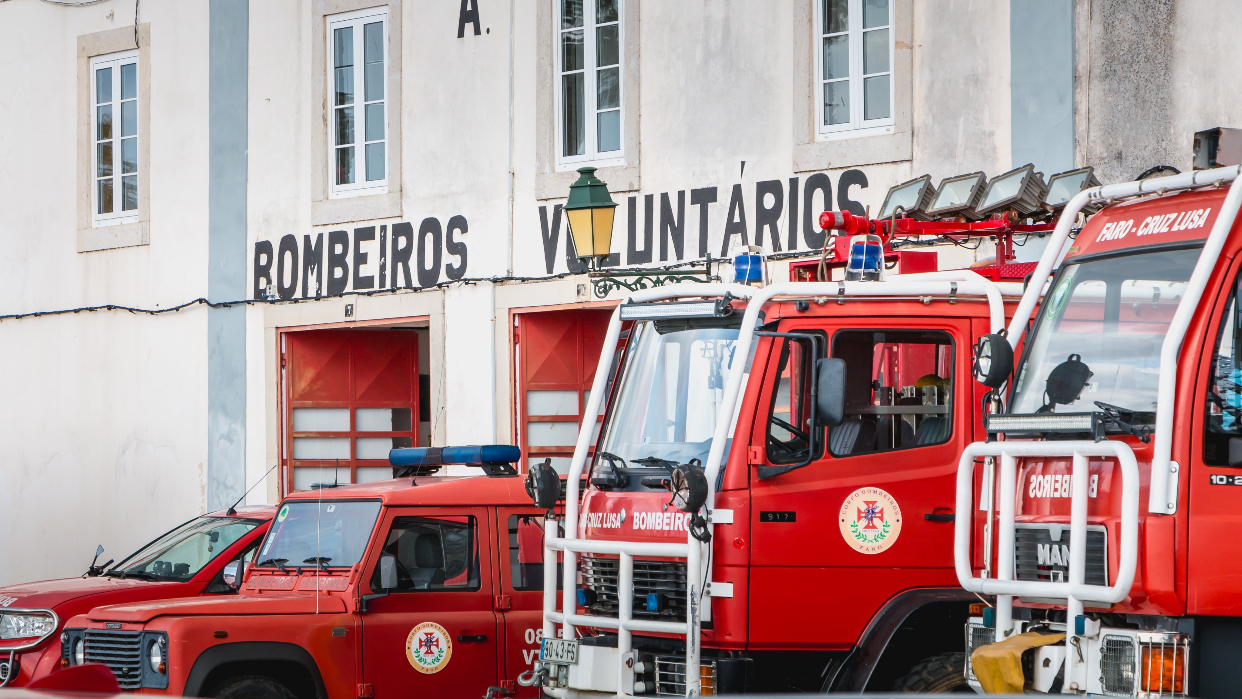 Fire trucks parked in front of a volunteer fire station in Faro