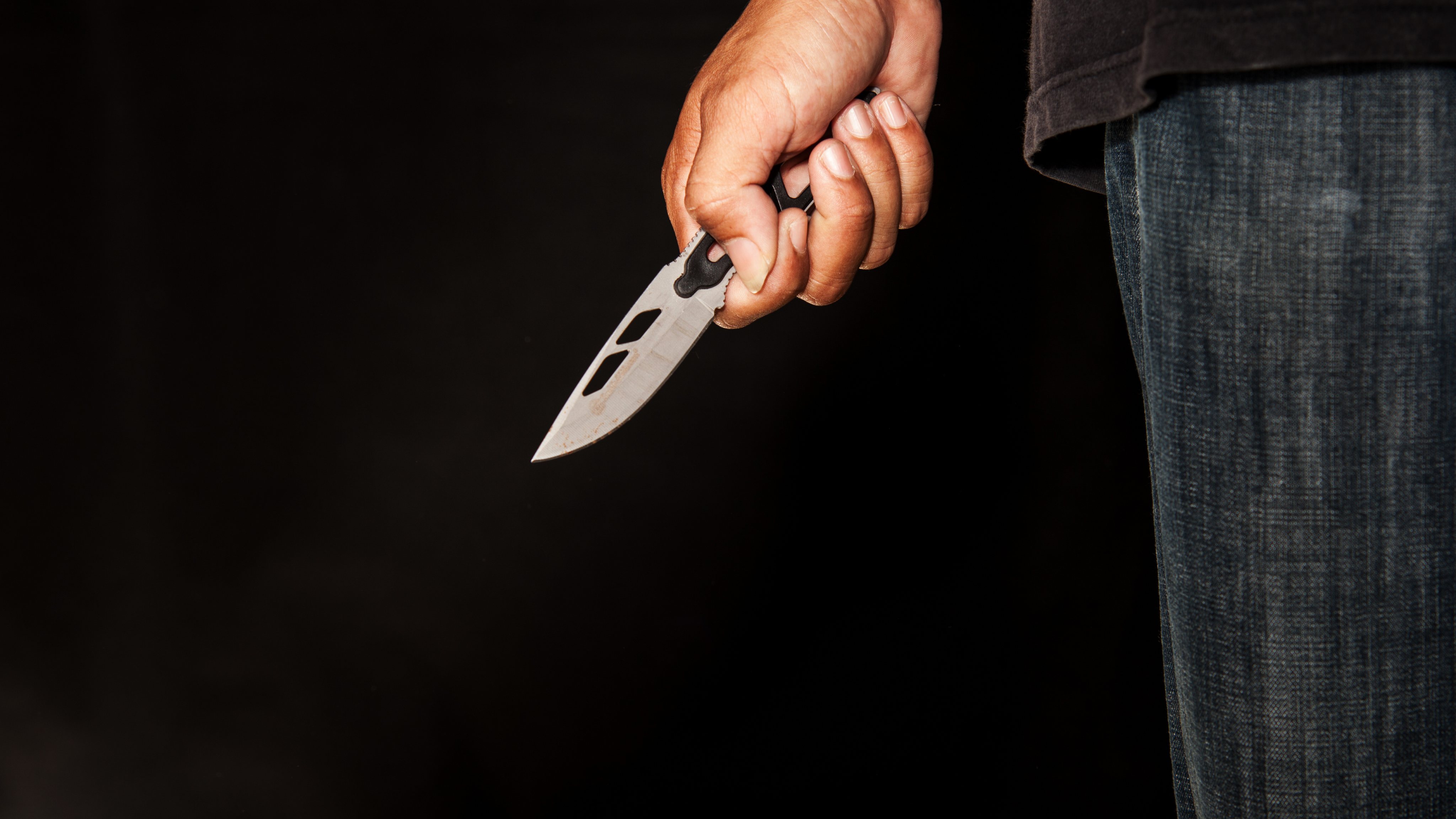 killer person with sharp penknife