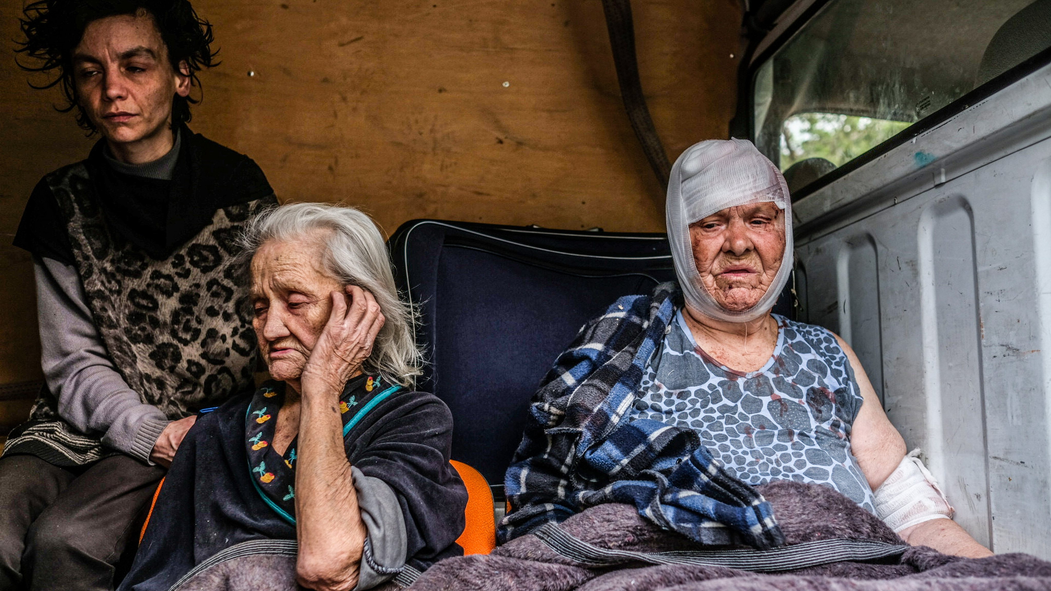 People from Severodonetsk are seen on a van that will take