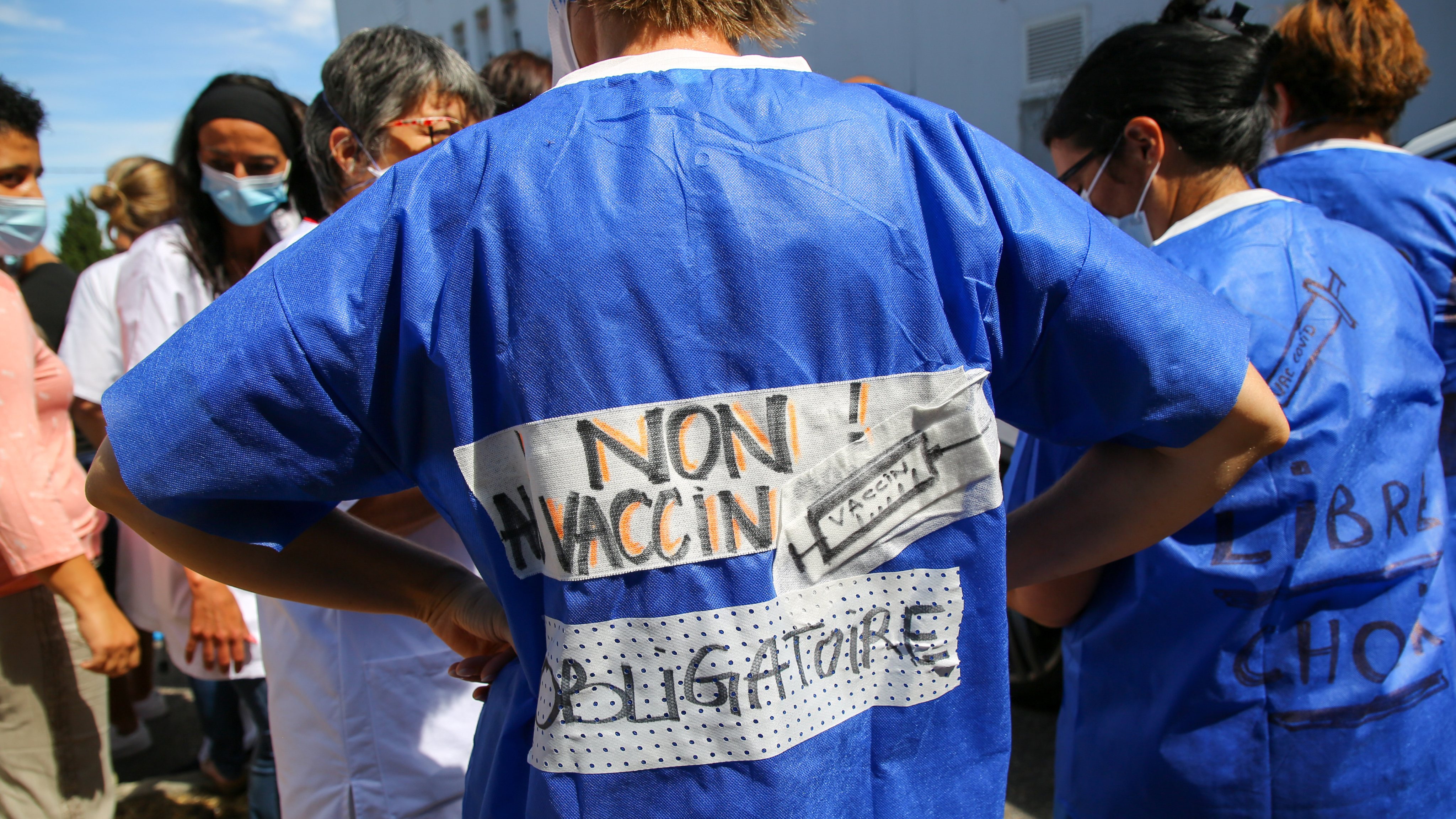 A protester seen with slogans written on back of her garment
