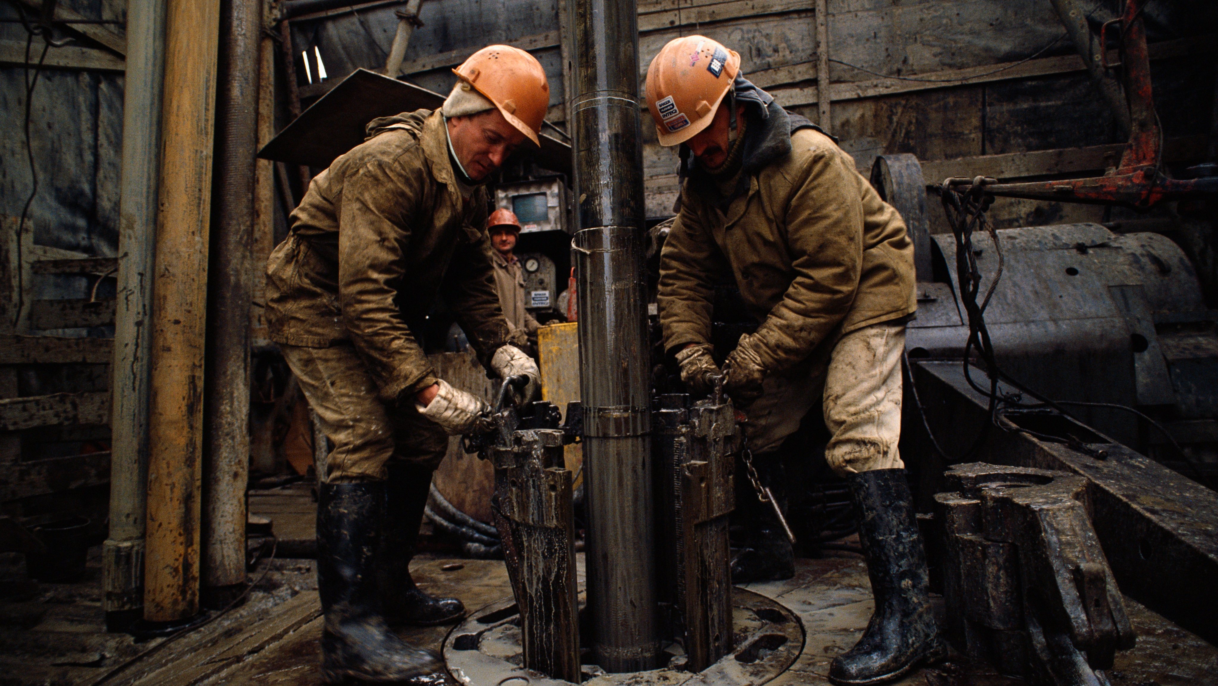 Workers Operate Oil Rig